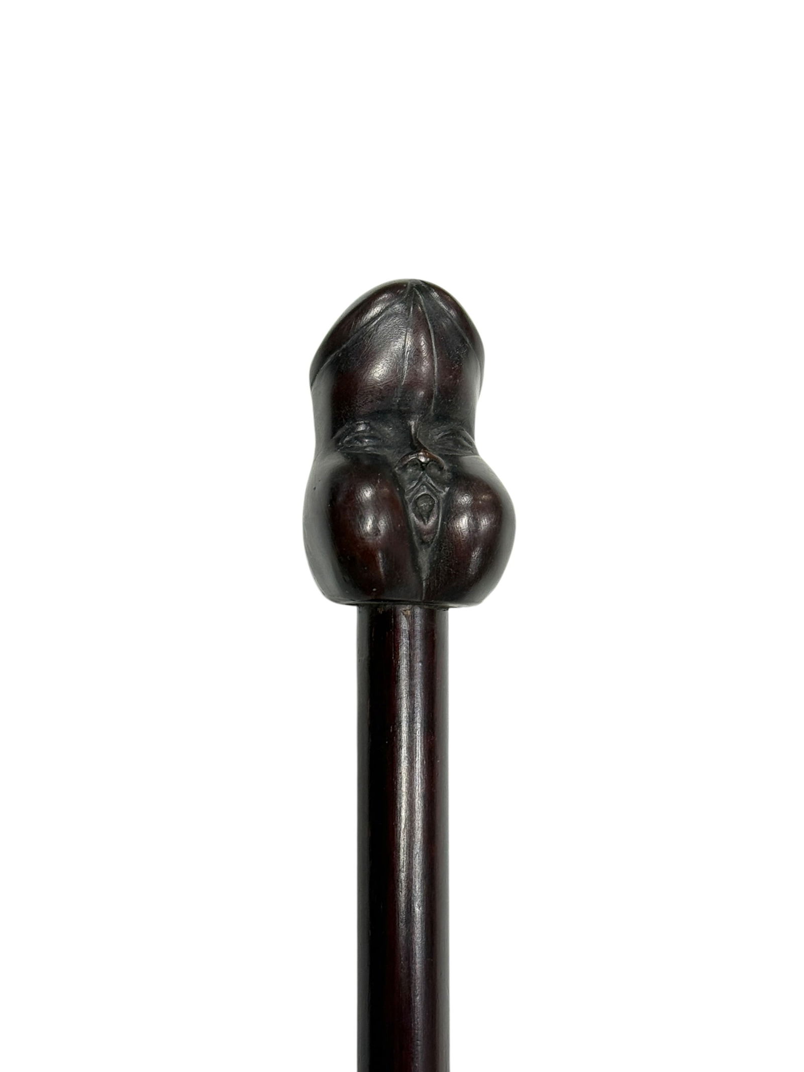 Hardwood Erotic Handle Cane w/ Carved Face: Antique hardwood walking cane with an erotic-form carved handle, incorporating a stylized face motif and sculpted anatomical shaping, finished in a deep dark stain with a smooth aged surface. The shaf