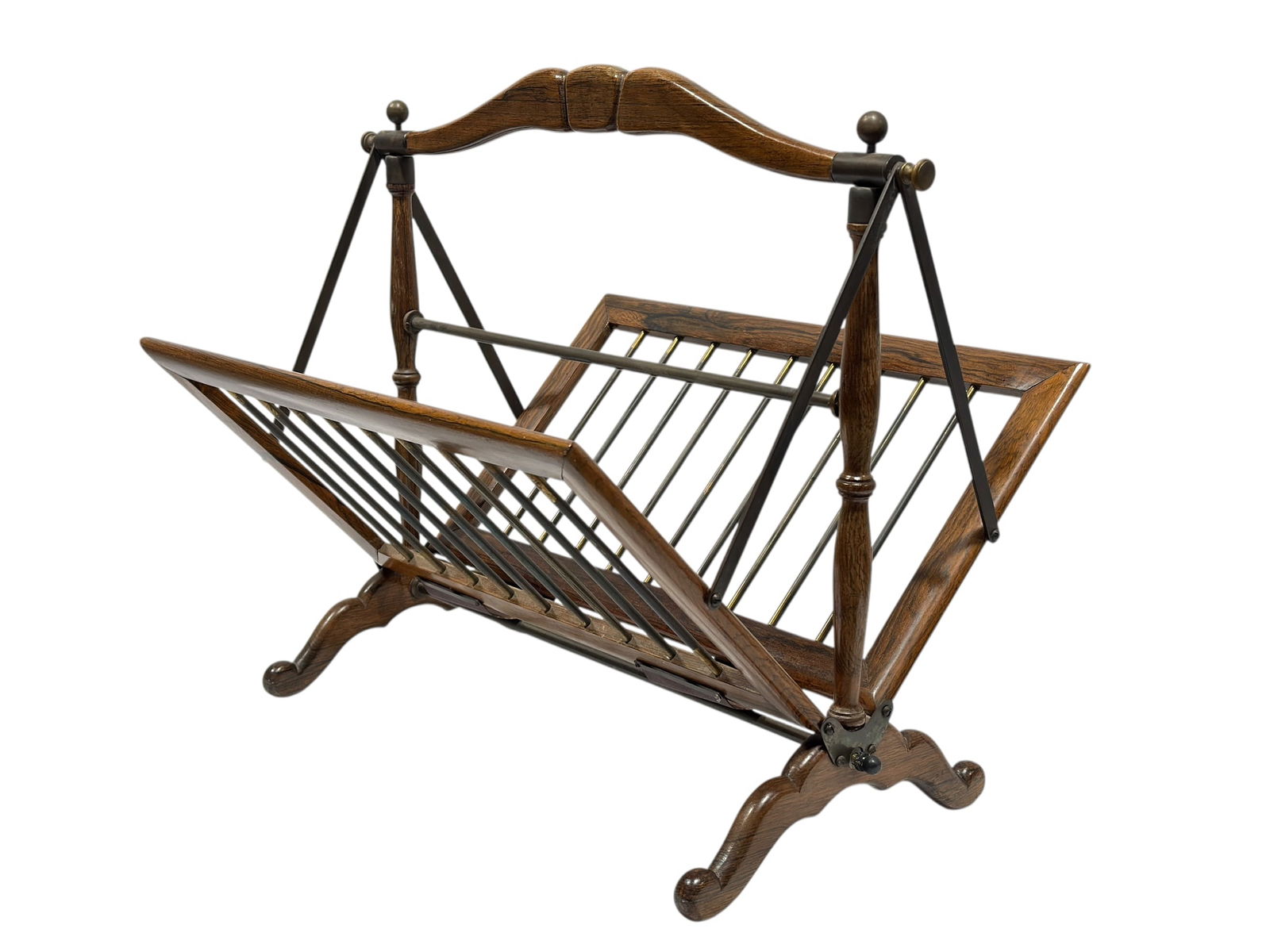 Mid-Century Rosewood & Brass Magazine Rack: Stylish mid-century modern magazine rack crafted with a richly grained rosewood frame and warm brass rod supports, featuring a sculptural silhouette with arched top handle, angled side supports, and o