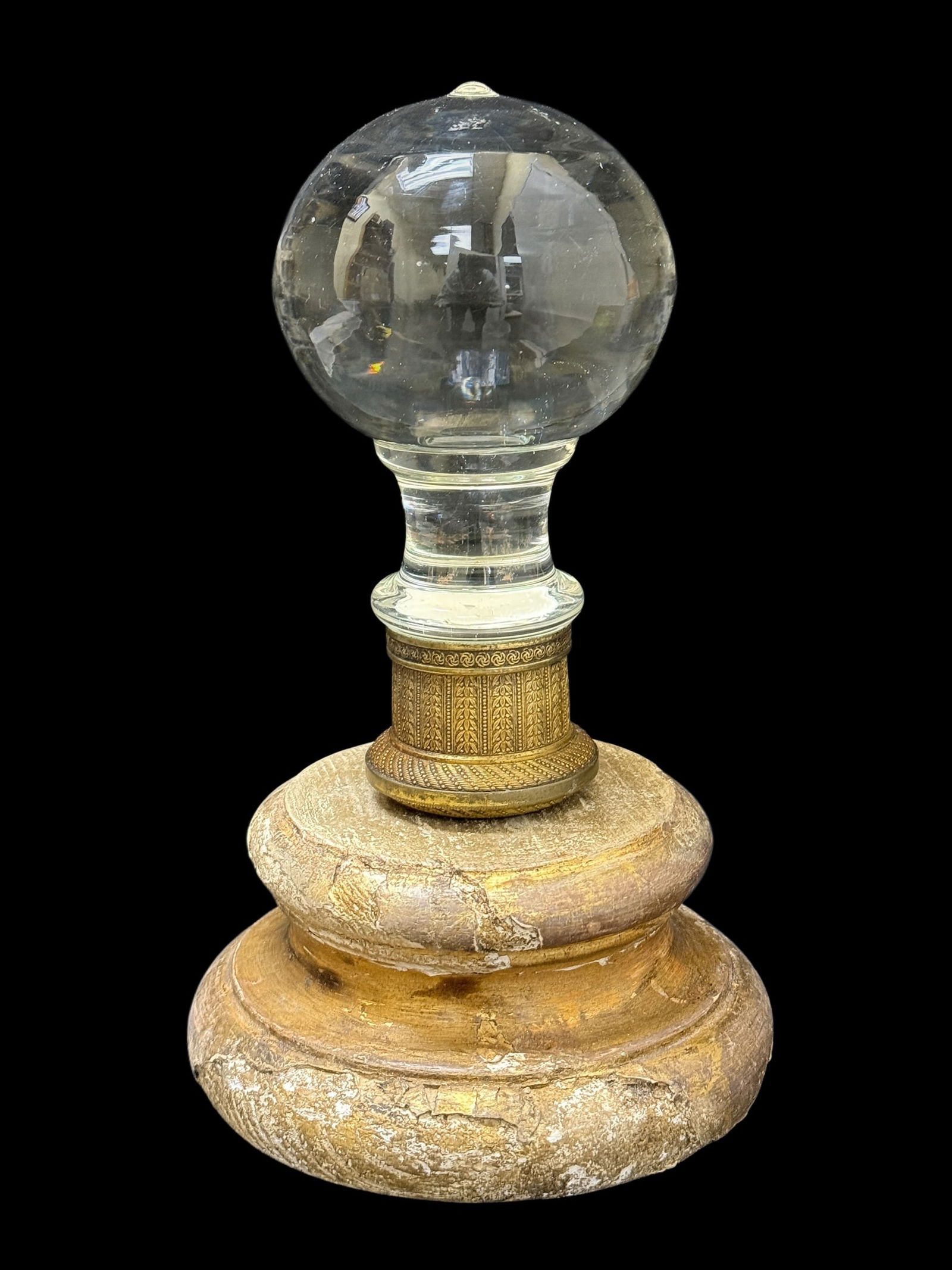 19th C. Empire Style Crystal Newel Post Finial on Giltwood Base: Striking 19th century Empire style newel post finial featuring a large clear crystal sphere mounted on a faceted and baluster-form crystal stem, set into an ornate gilt metal collar with classical lea