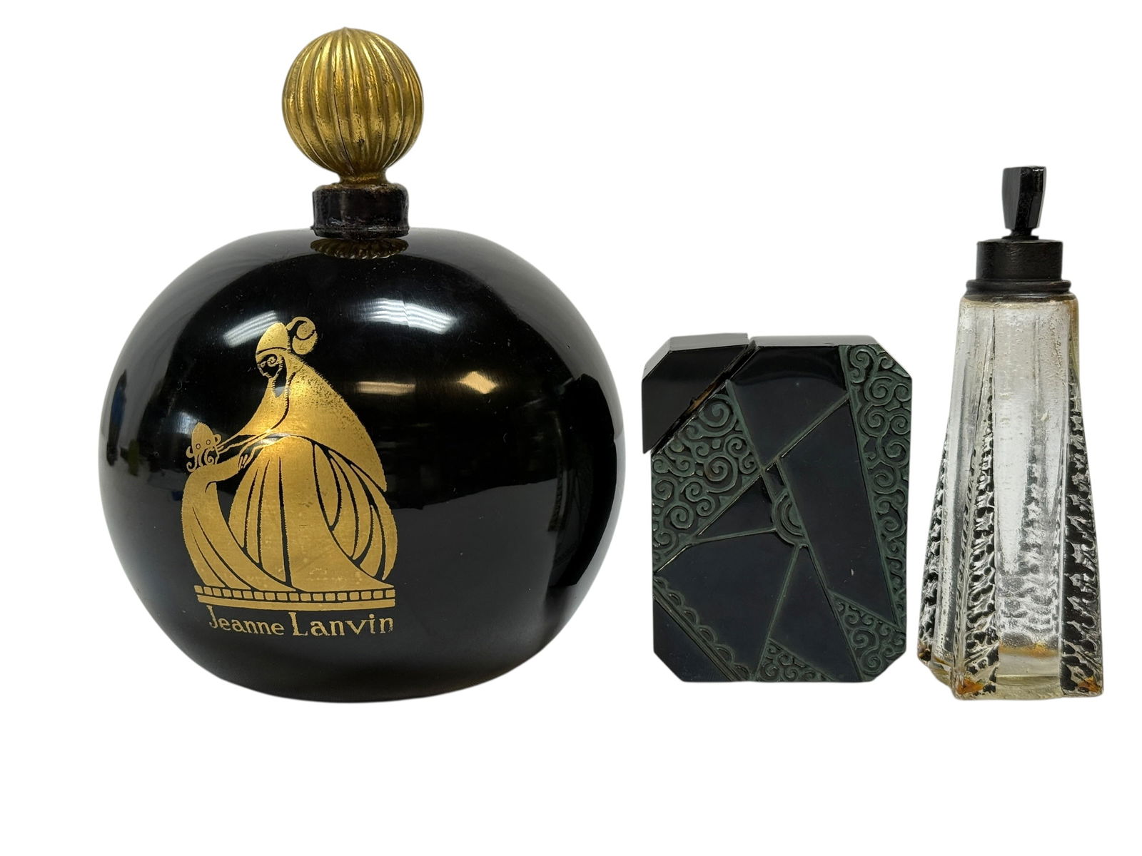 Group of 3 Art Deco Perfume Bottles: Collection of three vintage and Art Deco perfume bottles comprising a large commercial Jeanne Lanvin “Boule” bottle of rounded black glass form decorated in gold with the iconic mother-and