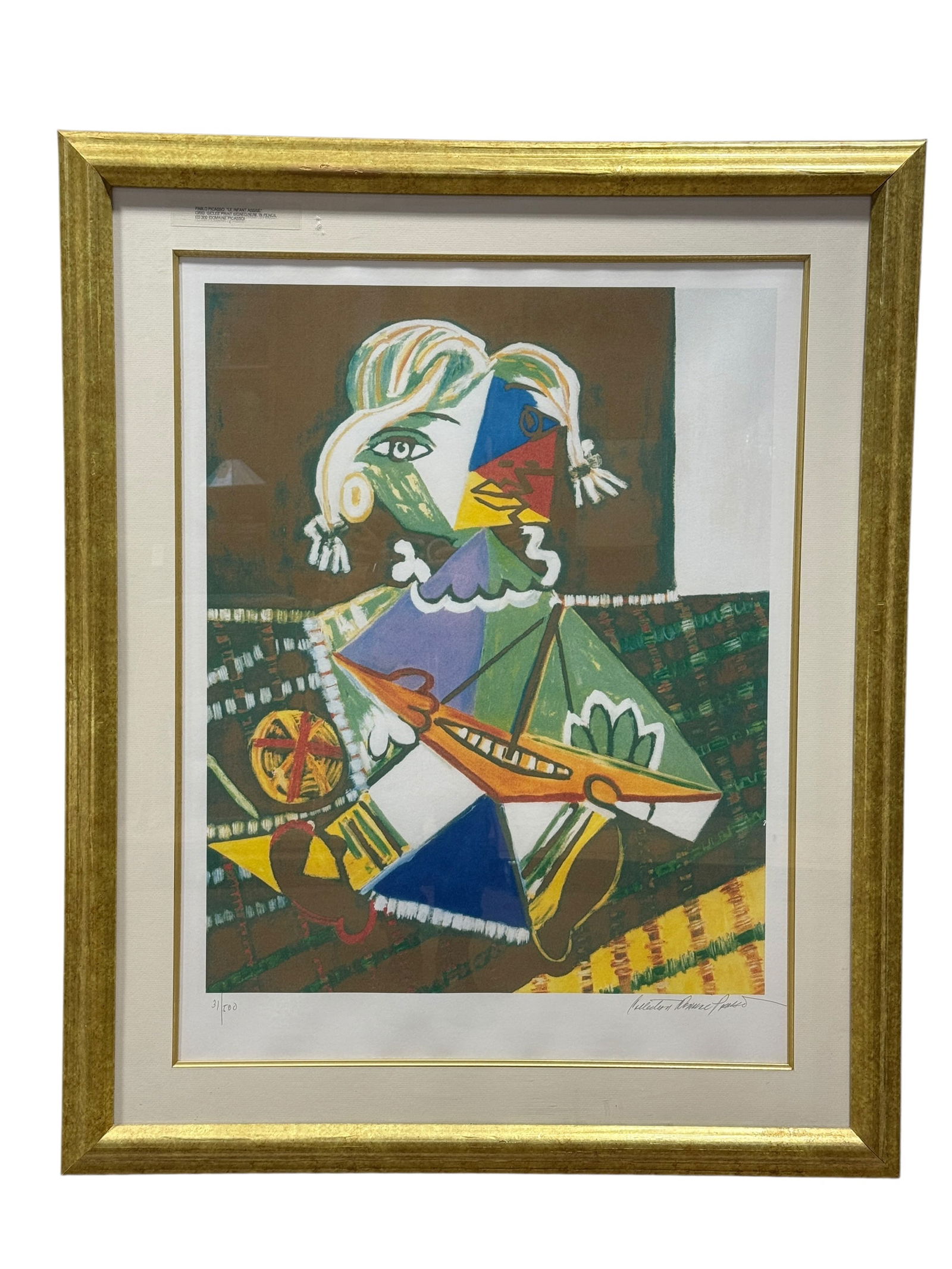 After Pablo Picasso “Le Enfant Assise" Giclée Print, Domaine Picasso Edition: Color giclée print after Pablo Picasso Picasso (Spanish, 1881–1973) titled Le Enfant Assise (“Seated Child”), depicting a Cubist-style seated figure holding a toy boat, rendered in bold