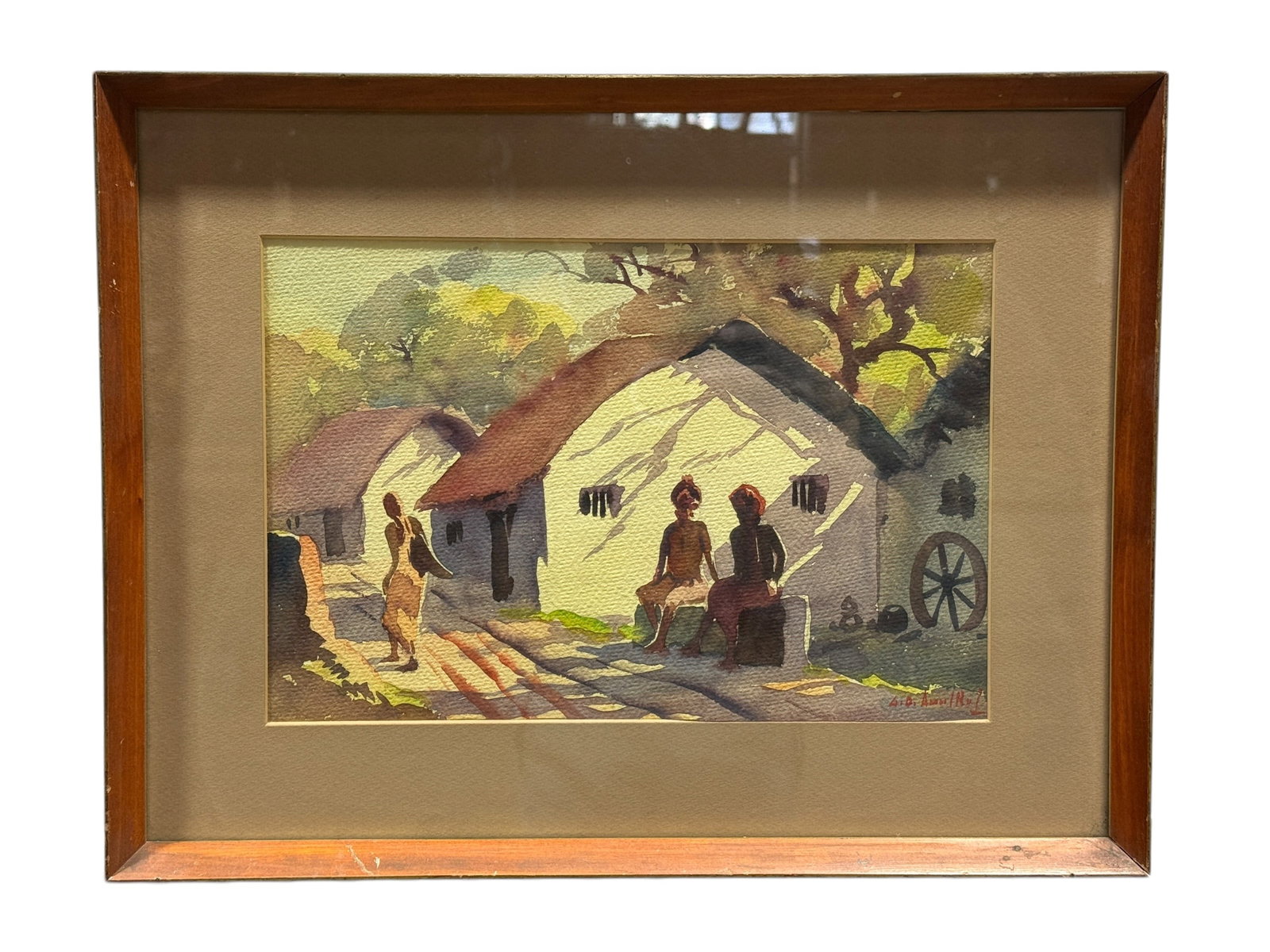 Mid 20th C. Signed Watercolor Village Scene w/ Figures: This framed watercolor depicts a charming village scene with several figures gathered along a sunlit path, rendered in a loose, expressive style with layered washes and confident line work that sugges