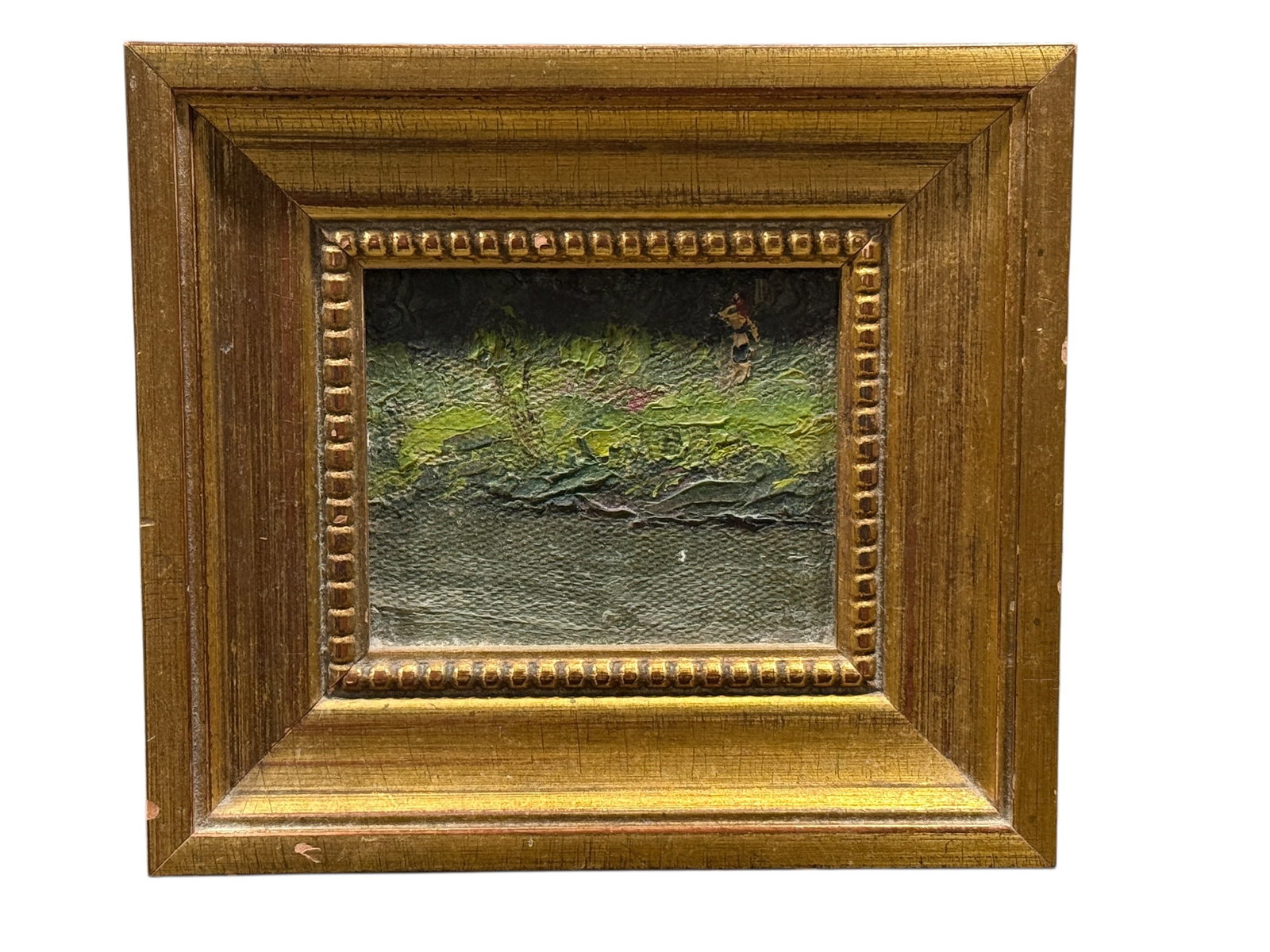 1905 Miniature Landscape Oil on Board, Figure in Meadow: Early miniature oil on board landscape painting depicting a small pastoral scene with a lone figure walking through a grassy meadow beside a body of water, rendered with thick impasto brushwork and a