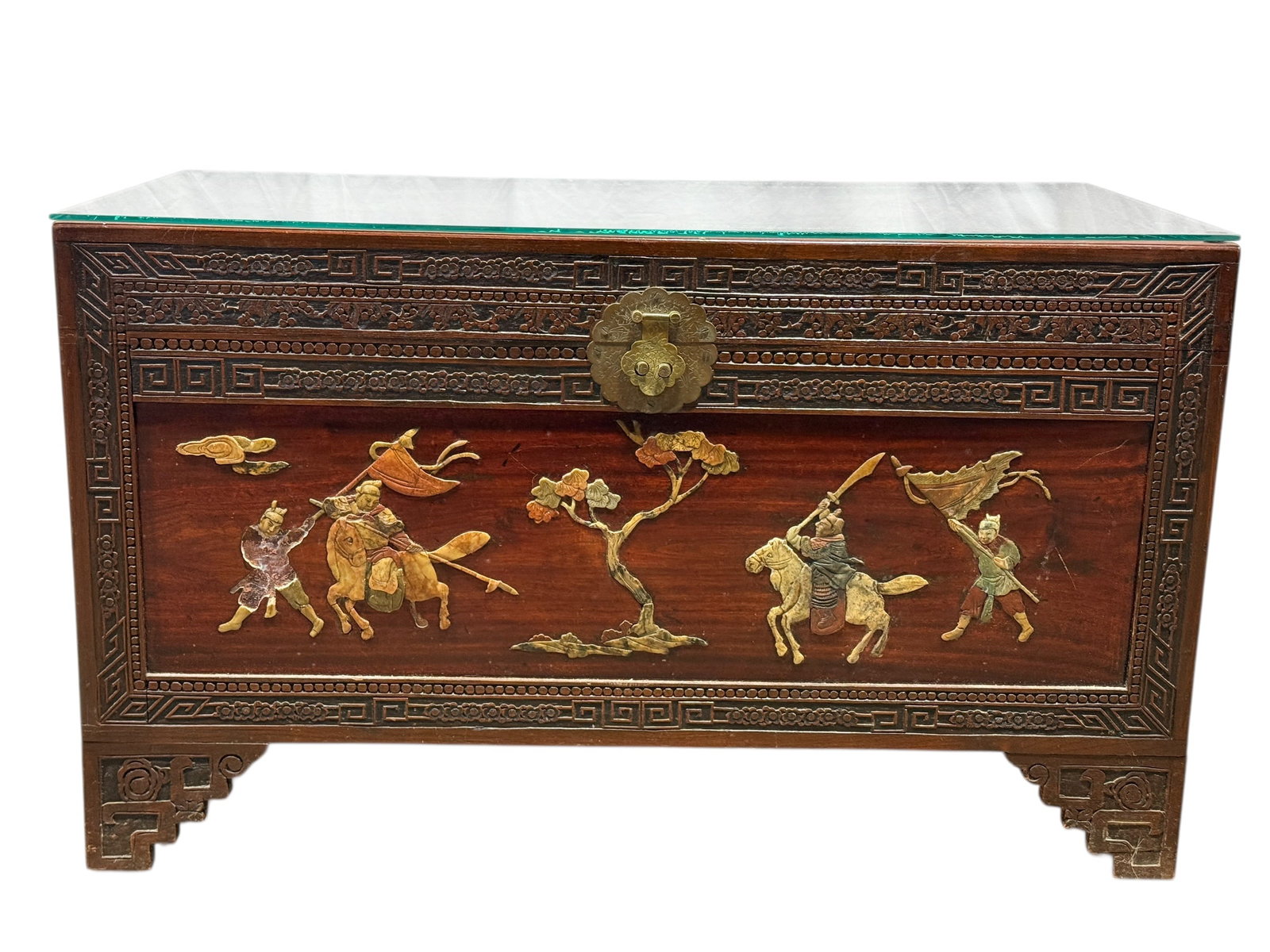 Asian Style Carved Wood Cedar Chest w/ Stone Inlay: Decorative Asian style carved wood storage cedar chest featuring elaborate stone and hardstone inlay panels depicting mounted warriors and attendants in a stylized battle or procession scene beneath b