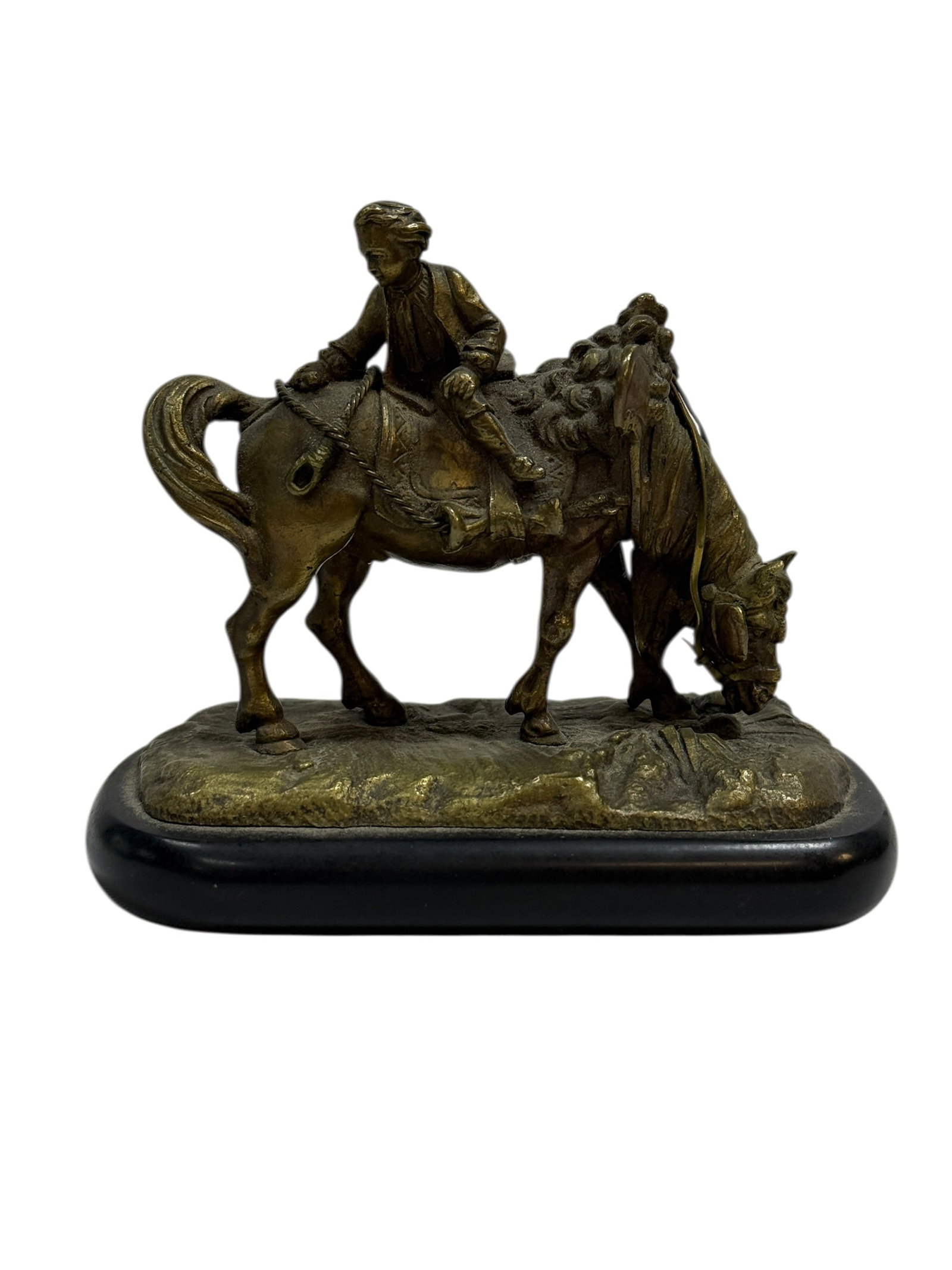 Fine Early 20th C. Bronze Horse & Rider Figurine on Slate Base: This fine contributor bronze sculpture features a detailed scene of a young rider seated atop a grazing horse, captured in a calm pastoral moment with excellent attention to texture in the mane, tack,