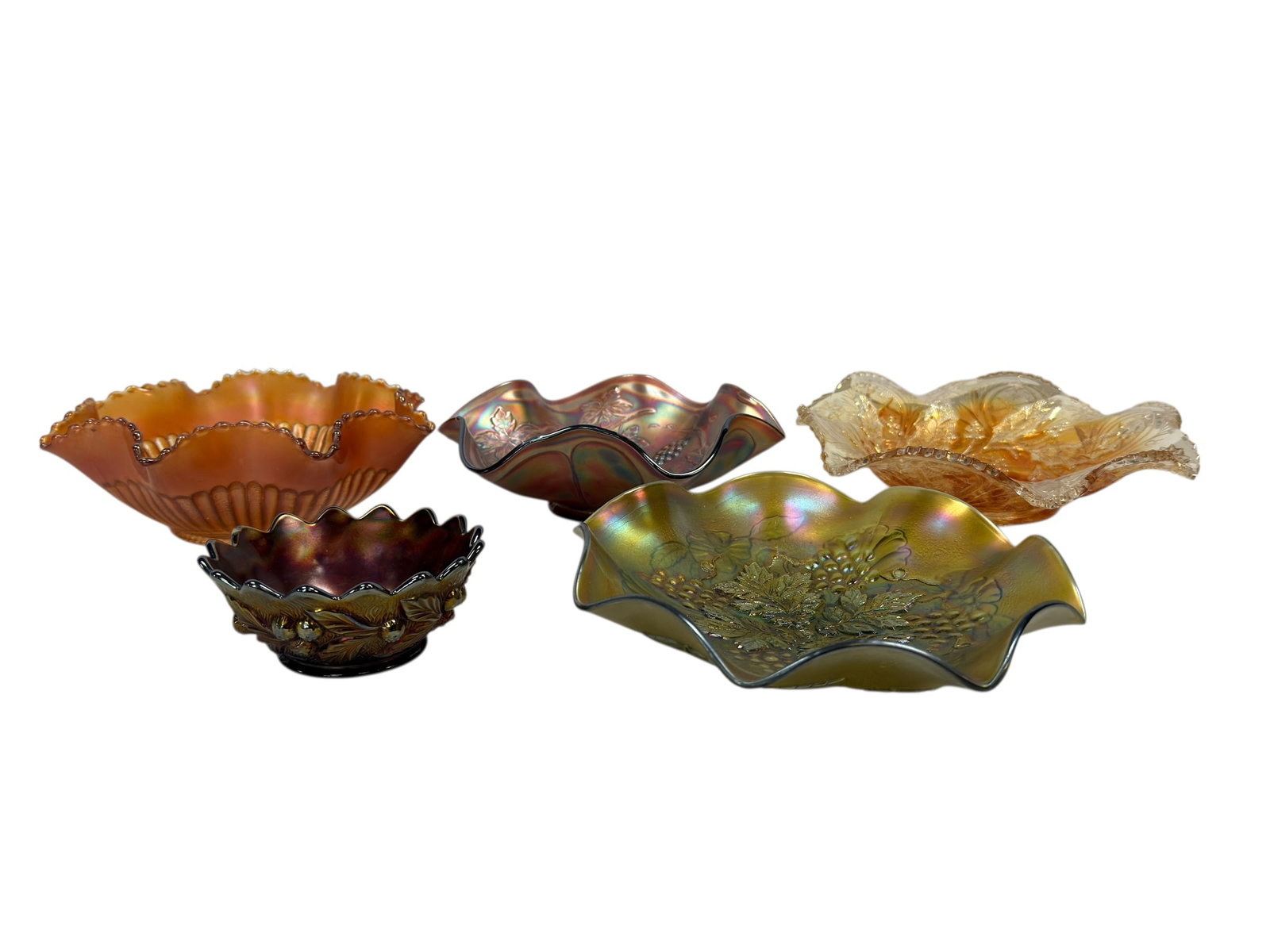 (5) Early 20th C. Millersburg & Northwood Carnival Glass Bowls: A vibrant and decorative group of five early 20th century carnival glass bowls attributed to Millersburg and Northwood, each exhibiting the richly iridescent surfaces and pressed patterns characterist