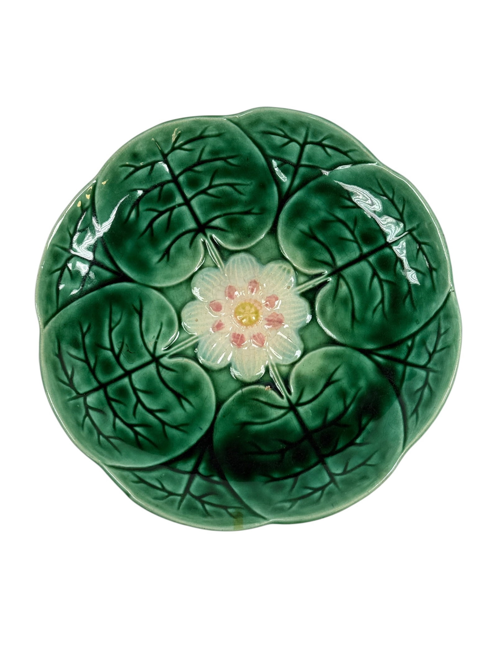 Circa 1870 Adams & Bromley English Majolica Water Lily Plate: A finely modeled and richly glazed English majolica plate by Adams & Bromley, circa 1870, featuring a naturalistic water lily design with overlapping lily pads rendered in deep variegated green glazes
