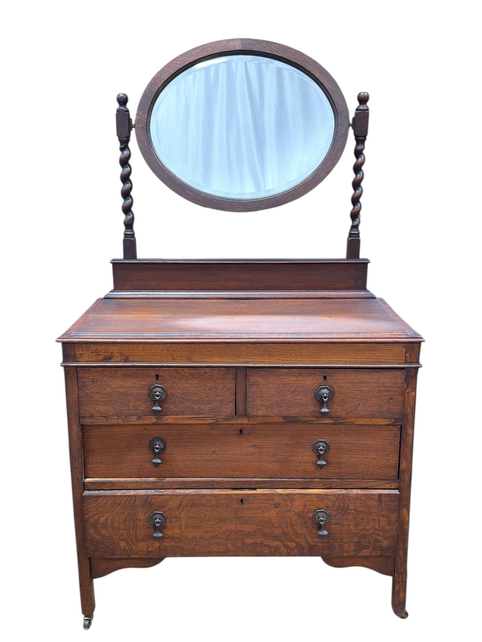 Late 19th-Early 20th C. American Tiger Oak Dresser w/ Mirror: Late 19th to early 20th century American dresser crafted in beautifully figured tiger (quarter-sawn) oak, featuring a classic form with a rectangular case supporting an original oval swivel mirror
