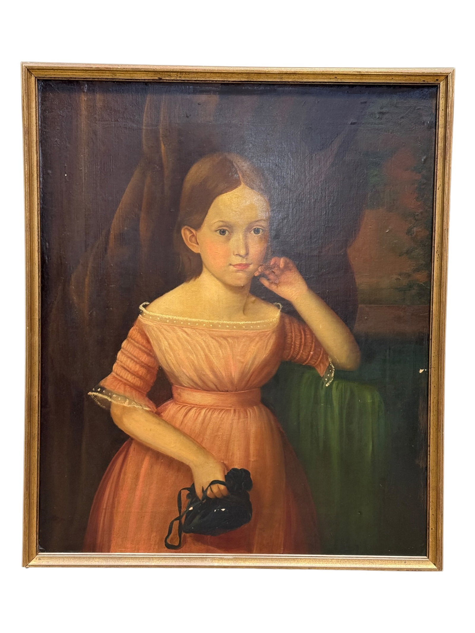 Early 20th Century Portrait of Young Girl in Pink Dress, Oil on Board: Early 20th century oil on board portrait depicting a young girl in a softly rendered, traditional academic style, shown seated beside a green-draped table and wearing a delicate pink dress with gather
