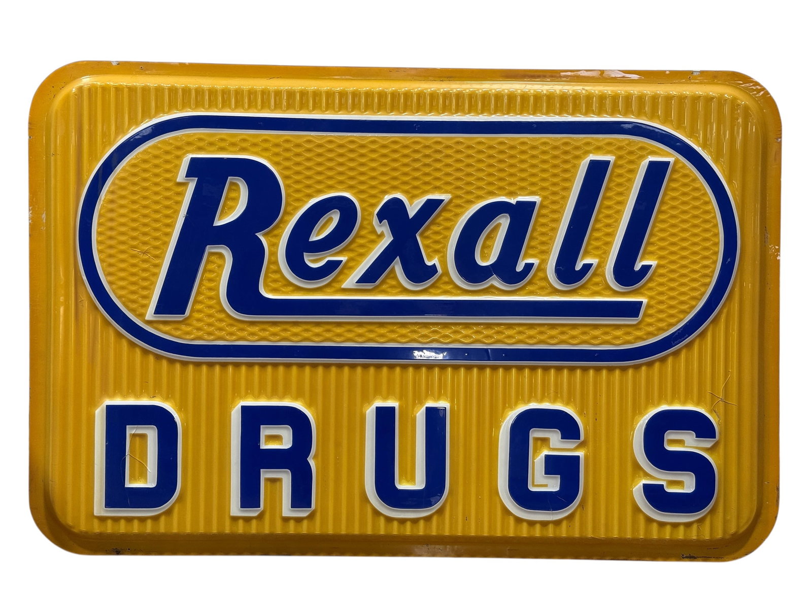 Rexall Drugs Vacu-Form Plastic Storefront Sign Face: Large vintage mid-20th century Rexall Drugs illuminated storefront sign face, manufactured in embossed vacu-form molded plastic and featuring the iconic “Rexall” script logo set within a blue 