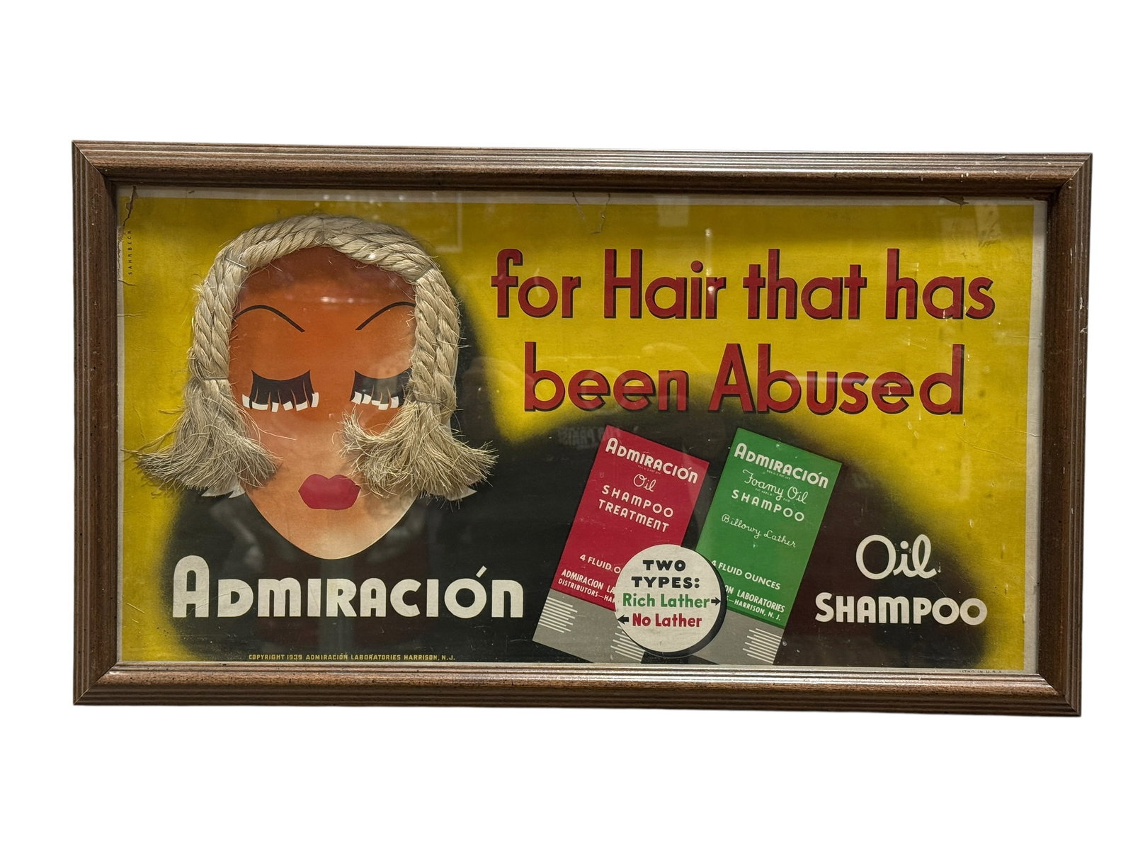 1939 Admiración Oil Shampoo "For Hair That Has Been Abused" Framed Advertising: Striking and unusual 1939 advertising display for Admiración Oil Shampoo, featuring a bold yellow and black graphic background with red lettering reading “for Hair that has been Abused,” high