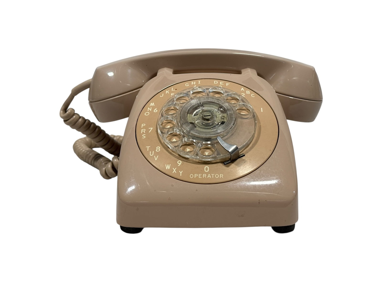 Vintage Automatic Electric Rotary Desk Telephone in Pink: Vintage mid-century Automatic Electric rotary dial desk telephone in an attractive pale pink color, likely dating to the 1950s–1970s. This classic hardline telephone features the traditional rotary 
