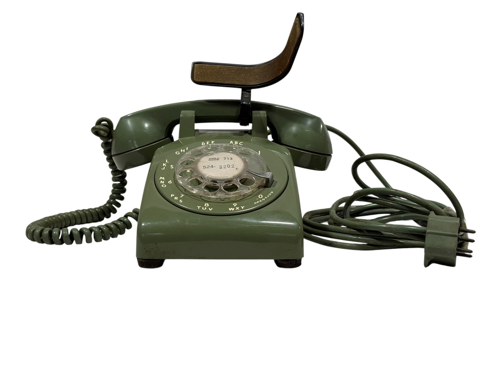 Vintage Bell System / Western Electric Olive Green Rotary Telephone: Classic mid-century Bell System / Western Electric rotary desk telephone in desirable olive green, featuring a black and brass operator or information plate mounted above the handset cradle. This auth