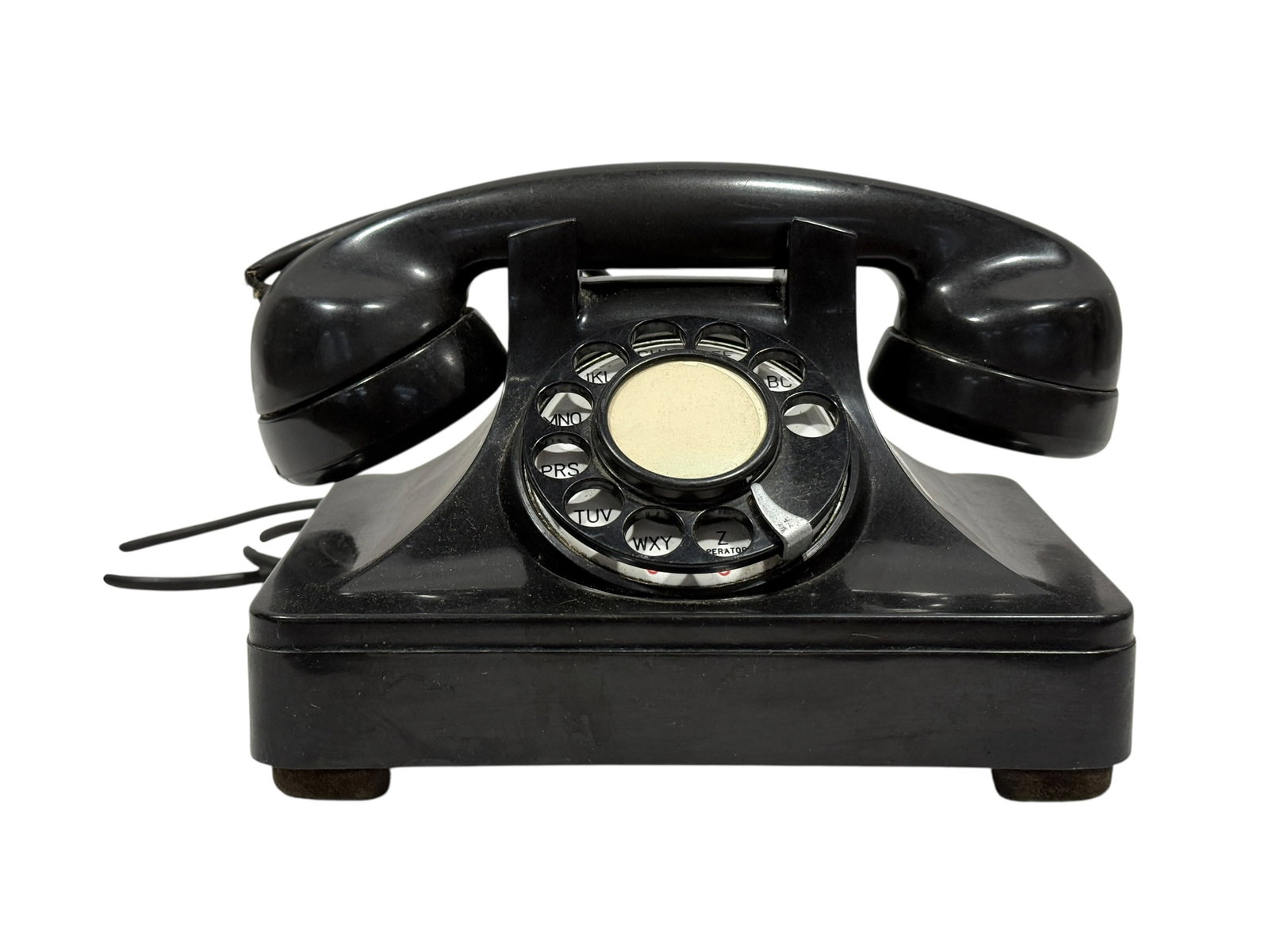 Vintage North Electric Model 7H6 Rotary Telephone: Mid-century black rotary desk telephone manufactured by The North Electric Mfg. Co. of Galion, Ohio, marked “7H6 HD” and “42 Cycle Ringer” on the underside base plate. This classic ind