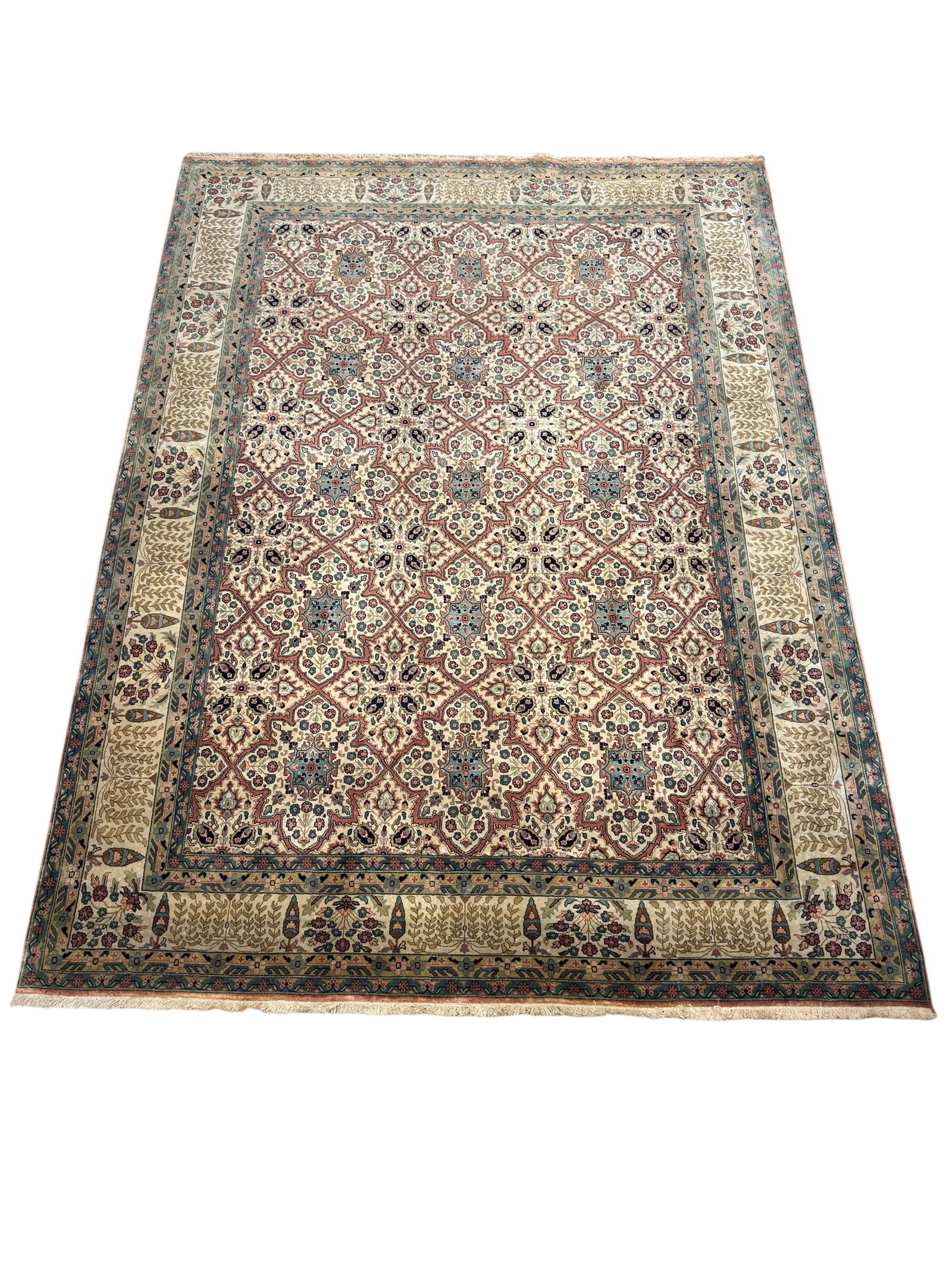 Large Kashan Design Hand-Knotted Indian Wool Carpet: A large hand-knotted Indian wool carpet in the Kashan pattern, featuring an ivory field decorated with an intricate repeating lattice of stylized floral medallions in soft rose, sage, teal, navy, and 