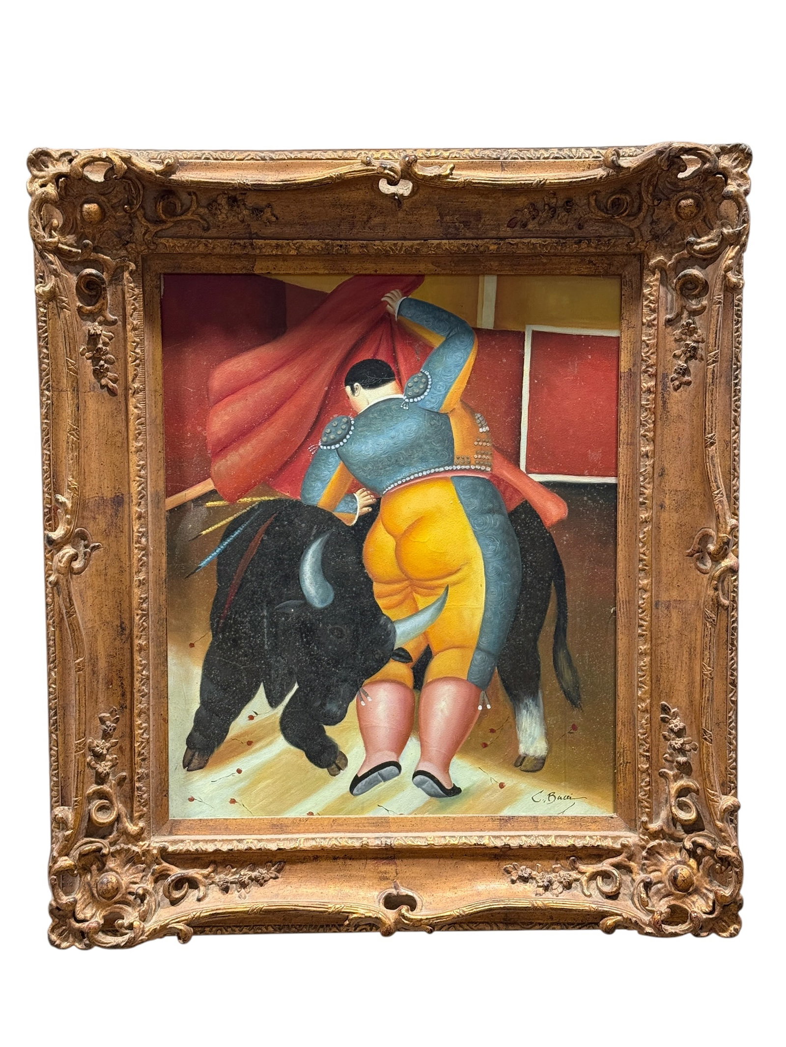 20th Century Signed Figural Bullfighter Oil on Canvas: A signed 20th century oil on canvas depicting a matador engaged with a charging black bull in a stylized composition reminiscent of the work of Fernando Botero, housed in an ornate carved giltwood fra