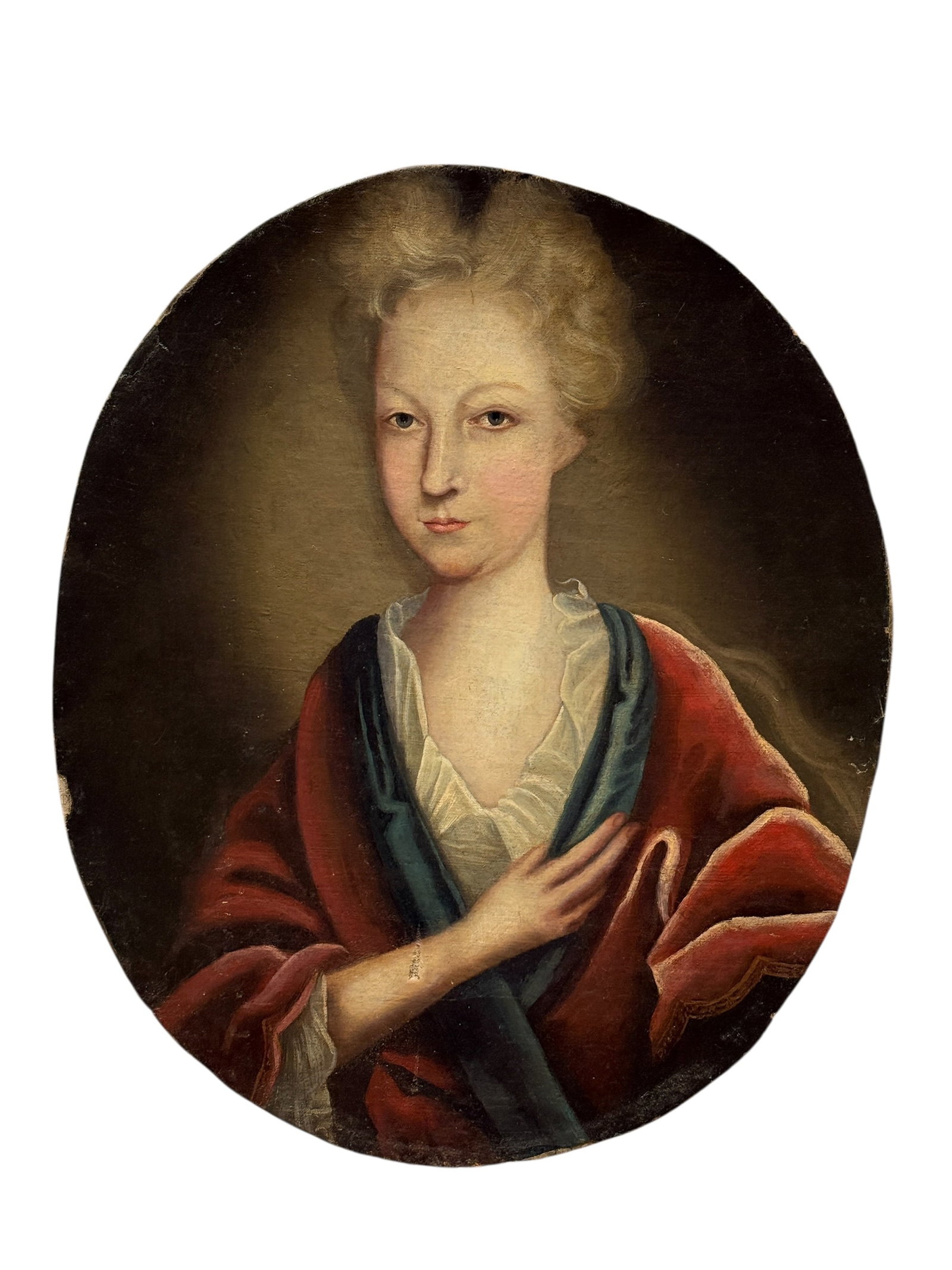 Circa 1920s Oval Oil on Canvas Portrait of a Young Woman: A 1920s oil on canvas portrait depicting a young woman in period attire with a white ruffled chemise, blue draped shawl, and deep red wrap, presented in an oval format. The unsigned work is executed i