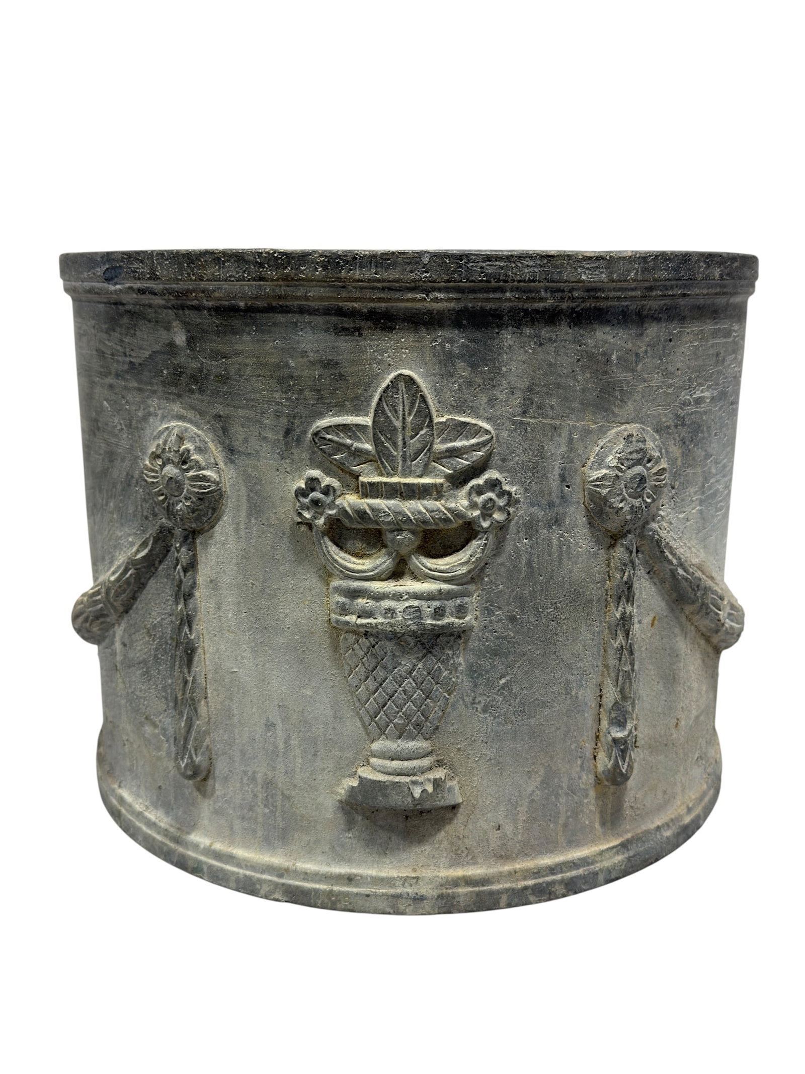 Antique Neoclassical Style Cast Lead Garden Planter: This substantial, heavy garden planter is made from cast lead and features classic Neoclassical style decorative relief work. The cylindrical body is adorned with raised molding depicting detailed cla