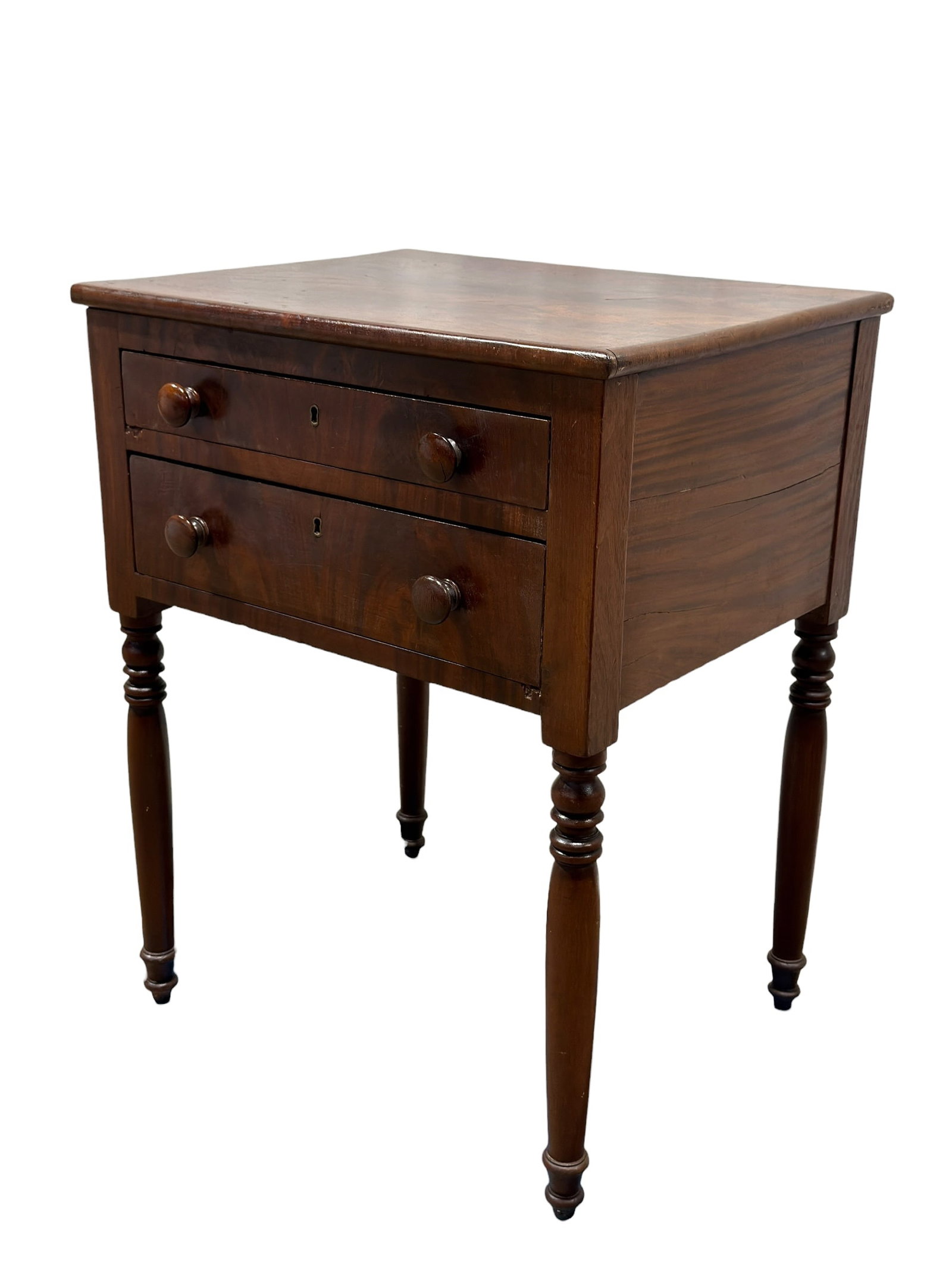American Federal Style Crotch Mahogany Two-Drawer Work Table: A classic American Federal style (Sheraton influenced) mahogany two-drawer side or work table. The rectangular top features a book-matched, highly figured crotch mahogany veneer field. The case houses