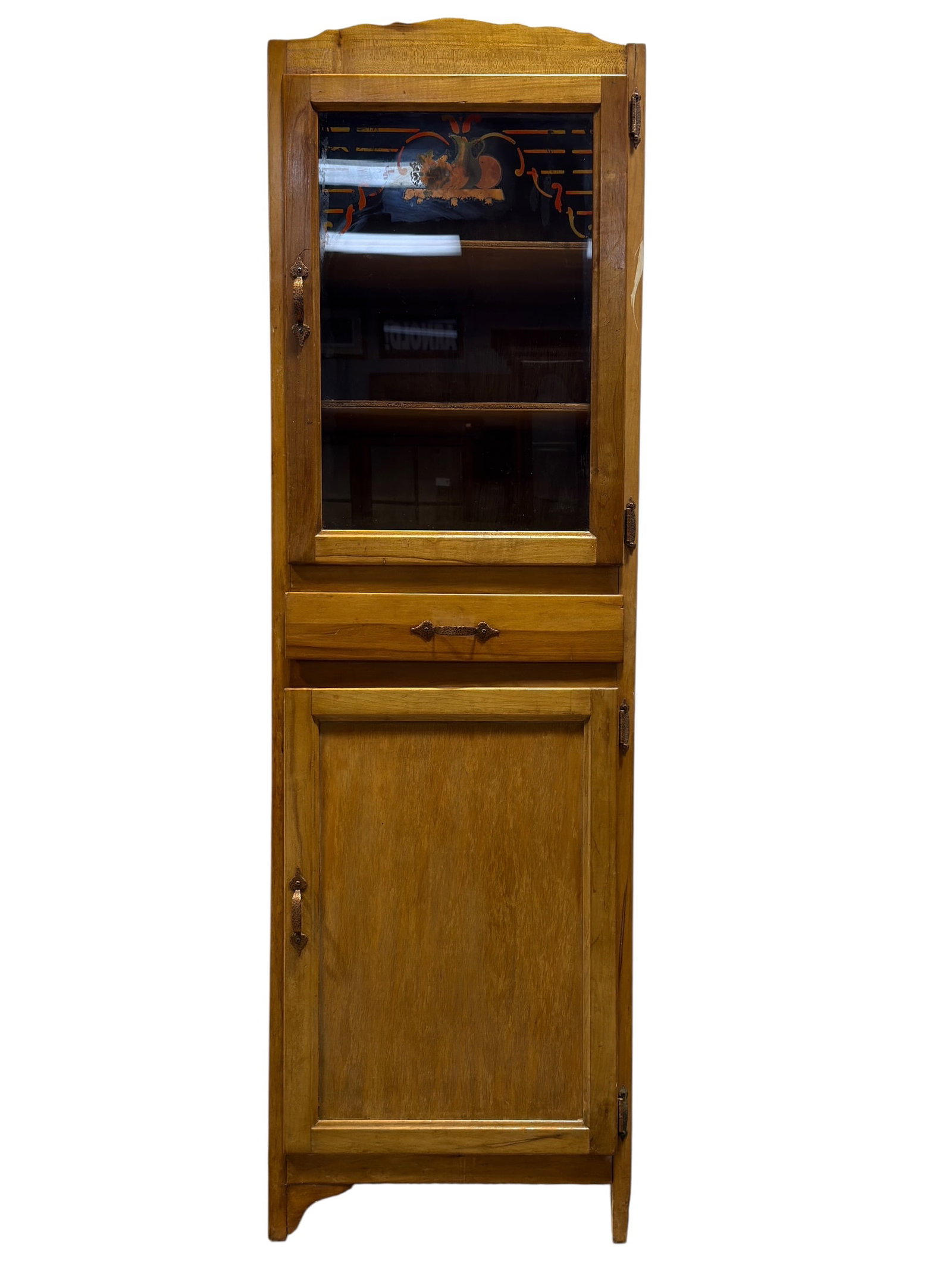 Vintage Chimney Cupboard w/ Painted Glass Door: A vintage mid-20th-century tall and narrow wooden chimney cabinet or hutch. This rustic, utilitarian piece is crafted with a warm honey-amber stained finish and features a straight-front profile toppe