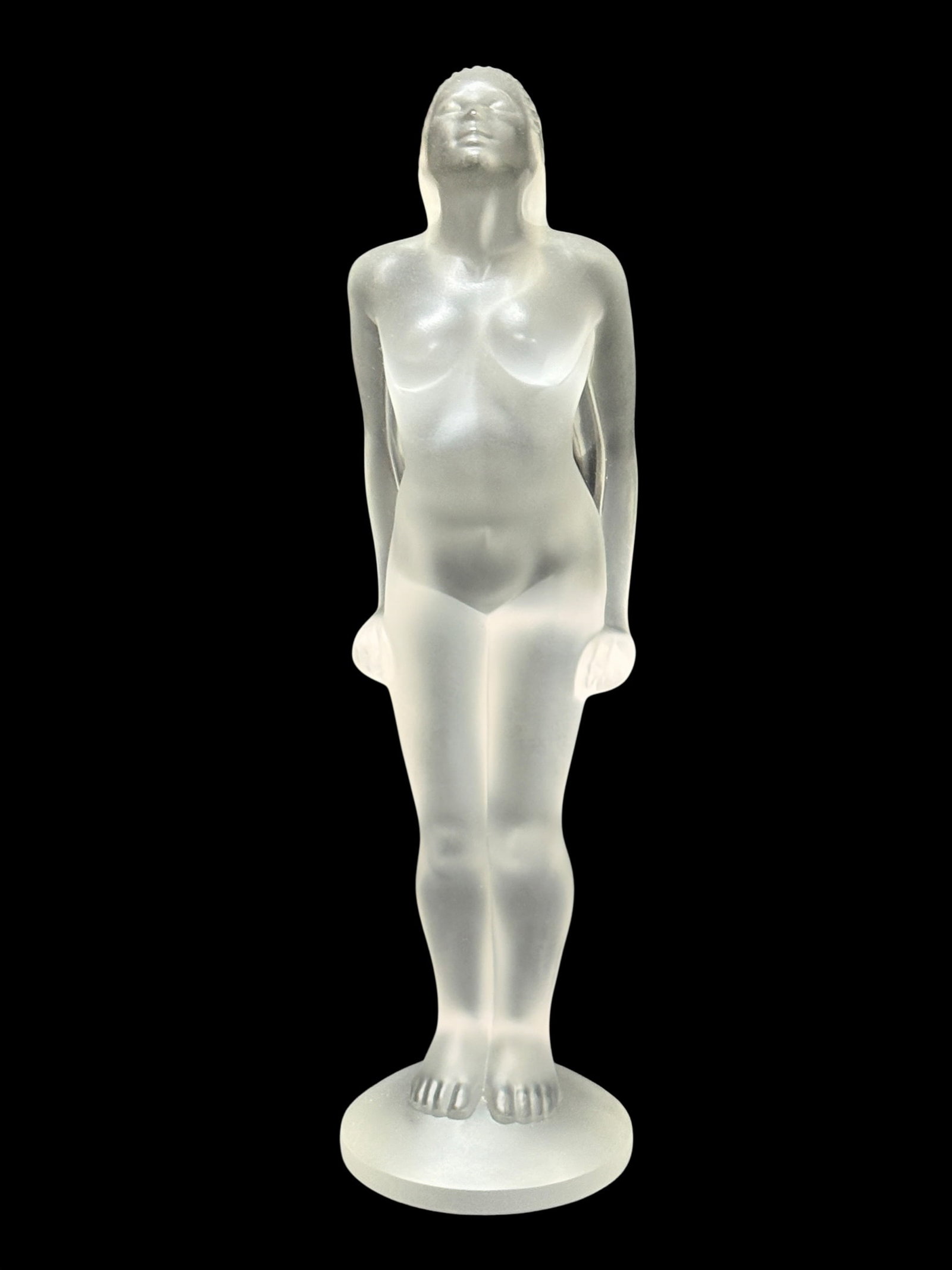 Signed Lalique France Frosted Crystal Standing Female Nude Figurine: A striking late 20th-century French molded and satin-finished frosted crystal figural sculpture, showcasing the iconic elegance and fluid classicism synonymous with Lalique craftsmanship. The piece fe
