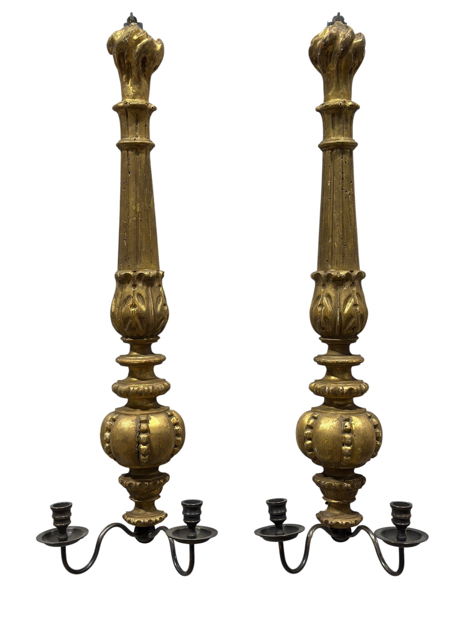Pair of 19th C. French Carved Giltwood Baroque Style Wall Sconces: An elegant pair of 19th-century French wall sconces designed in the grand Baroque taste. Each sconce features an elongated, architectural backplate expertly carved from wood, tapering upward to a styl