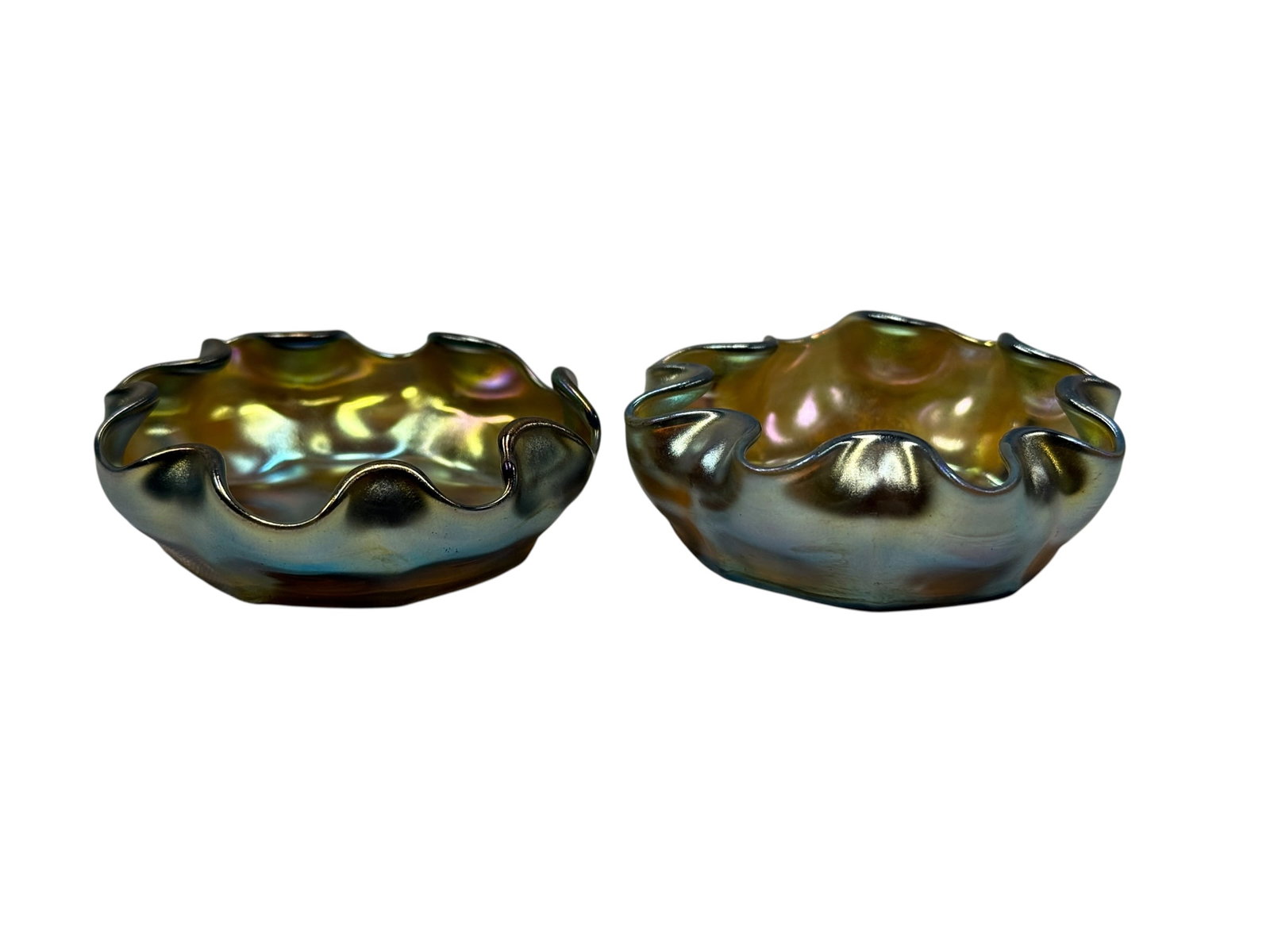 Pair of Signed Louis Comfort Tiffany Favrile Ruffled Salt Cellars: This is a fine matching pair of antique open salt cellars produced by Louis Comfort Tiffany. Each piece is individually hand-formed in classic Gold Favrile glass, showcasing an exceptionally vibrant, 