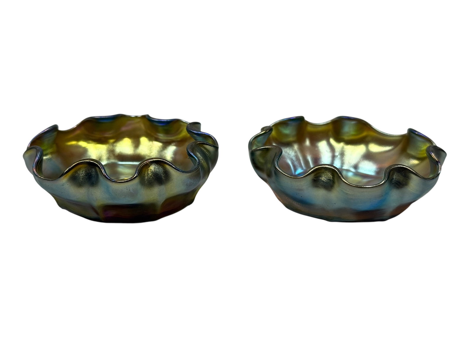 Pair of Signed Louis Comfort Tiffany Favrile Ruffled Salt Cellars: This is a fine matching pair of antique open salt cellars produced by Louis Comfort Tiffany. Each piece is individually hand-formed in classic Gold Favrile glass, showcasing an exceptionally vibrant, 