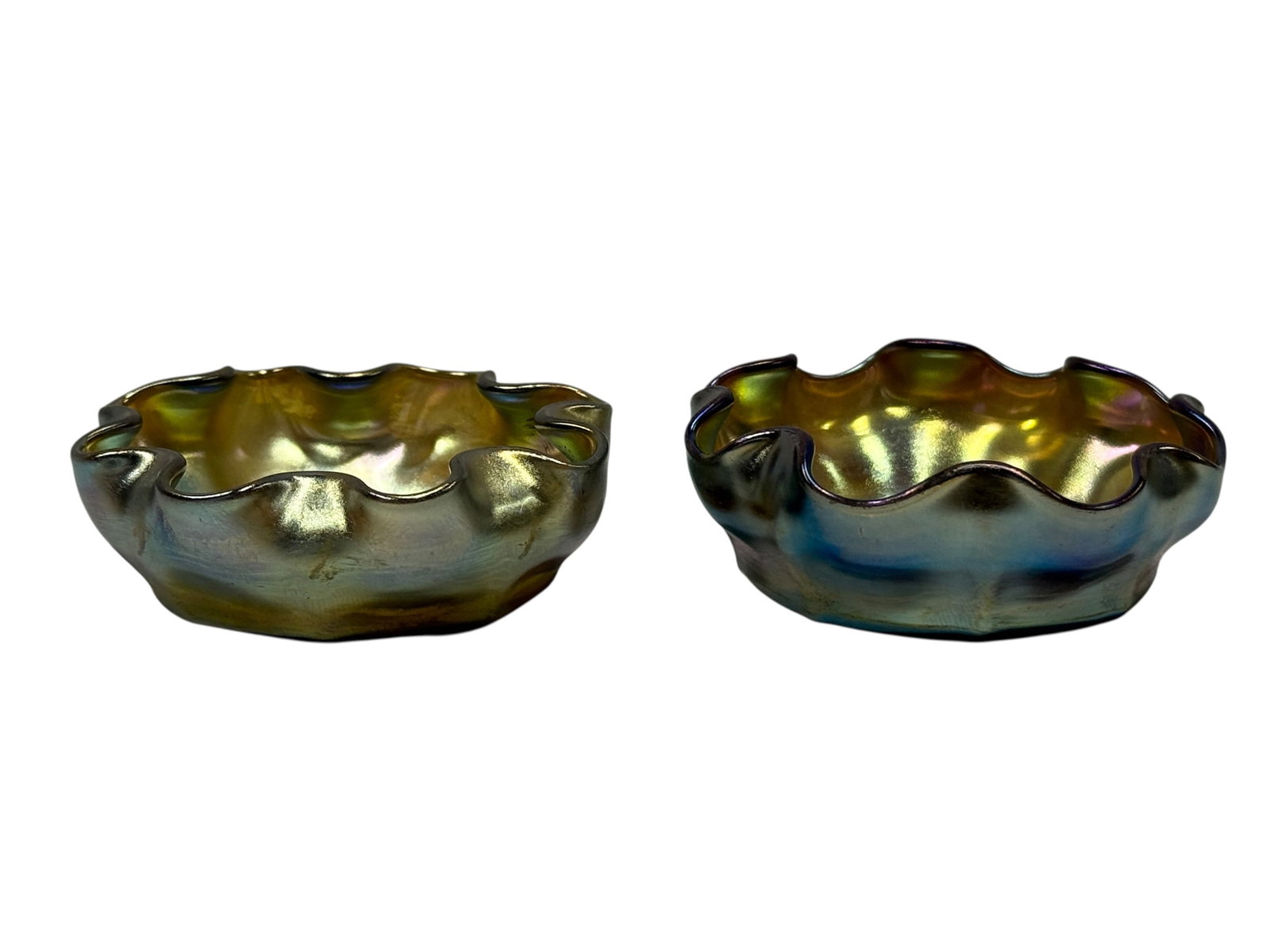 Pair of Signed Louis Comfort Tiffany Favrile Ruffled Salt Cellars: This is a fine matching pair of antique open salt cellars produced by Louis Comfort Tiffany. Each piece is individually hand-formed in classic Gold Favrile glass, showcasing an exceptionally vibrant, 