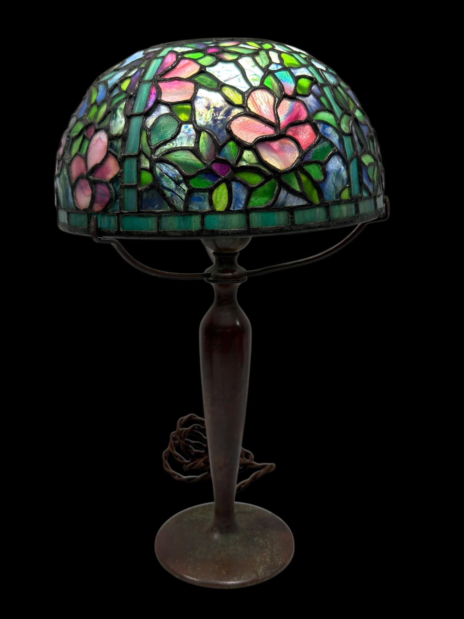 Tiffany Studios "Clematis" Leaded Glass and Bronze Desk Lamp: This is an authentic Art Nouveau desk lamp by Tiffany Studios, New York, featuring an intricately crafted 12-inch "Clematis" leaded glass shade. While the Clematis pattern is more commonly seen in lar