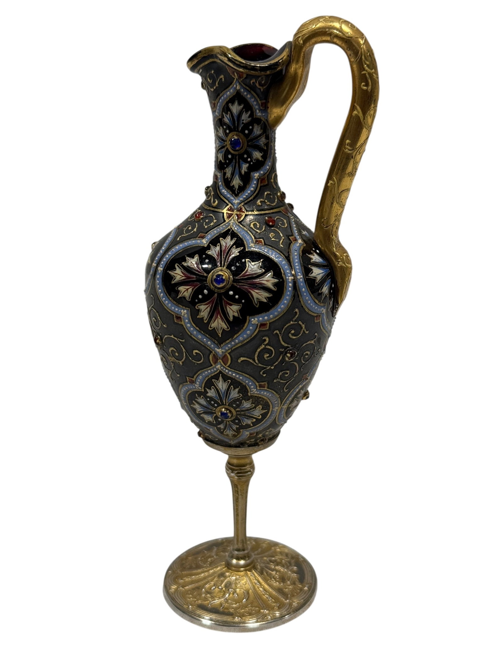 Late 19th-Century Jeweled Enameled Silver-Mounted Moser Miniature Ewer: This delicate and highly detailed miniature ewer is crafted in the exquisite style attributed to the prestigious Bohemian glasshouse, Moser. The body is elegantly encased in a silver framework decorat