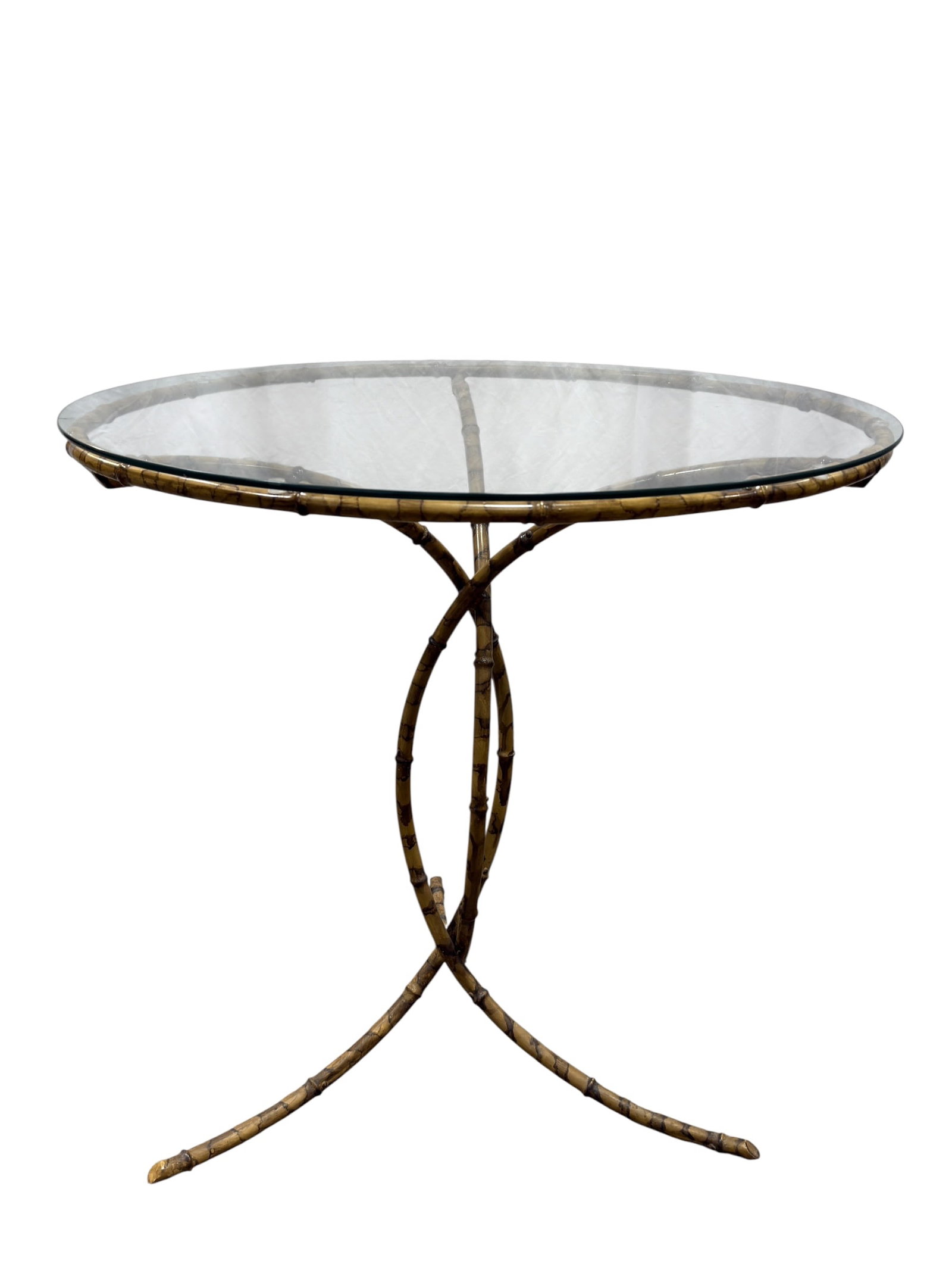 Mid-Century Hollywood Regency Faux Bamboo Iron Accent Table: An elegant mid-century Hollywood Regency style accent table featuring a highly detailed faux bamboo metal frame and a circular glass top. The frame is masterfully crafted from iron, which has been met