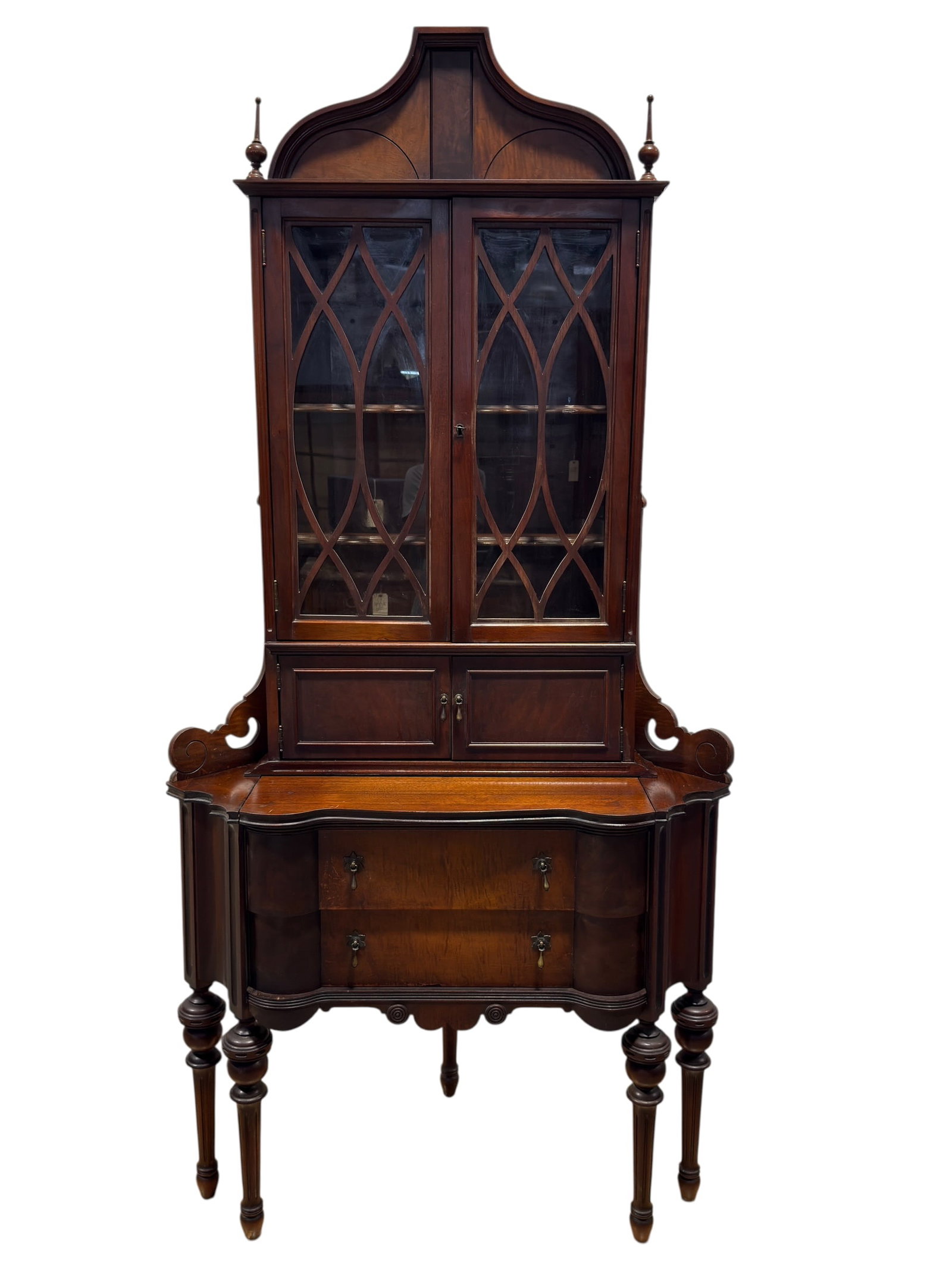 c. 1940's Federal Revival Figured Mahogany Corner Secretary Desk: This is a functional and distinct vintage corner secretary desk, manufactured by the Illinois Cabinet Company of Rockford, Illinois. Engineered to utilize corner spaces, the piece is constructed with 
