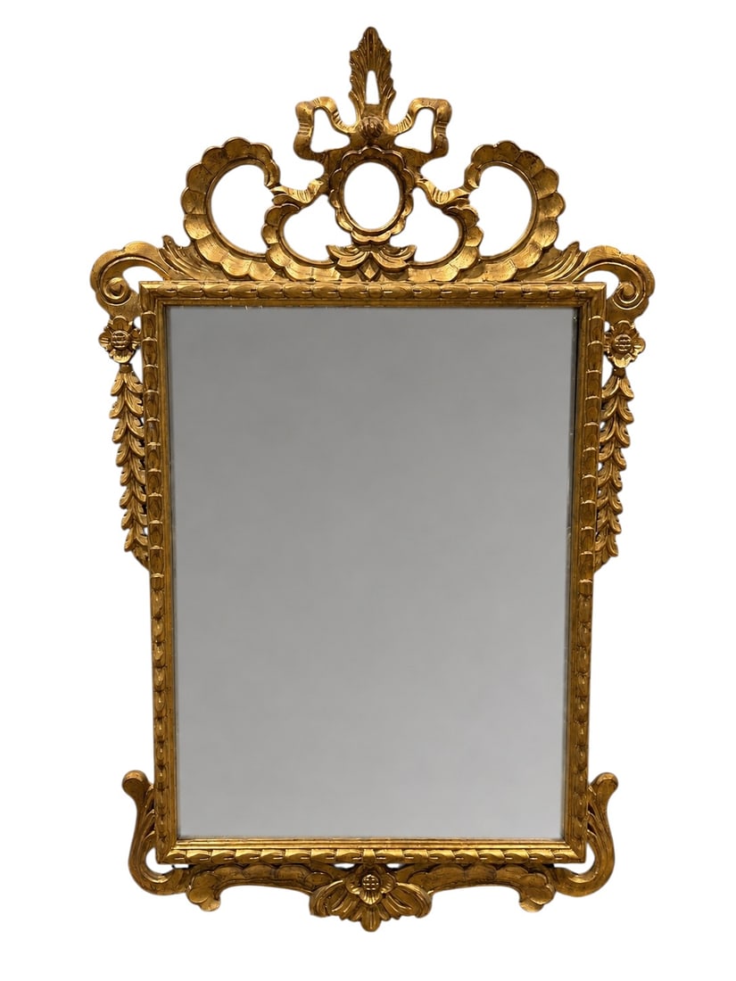 Mid Century Italian Giltwood & Gesso Mirror: This large, rectangular wall-mounted mirror features an elaborate, architecturally-inspired giltwood and gesso frame with Italian influences. The defining feature of the piece is the ornate, oversized
