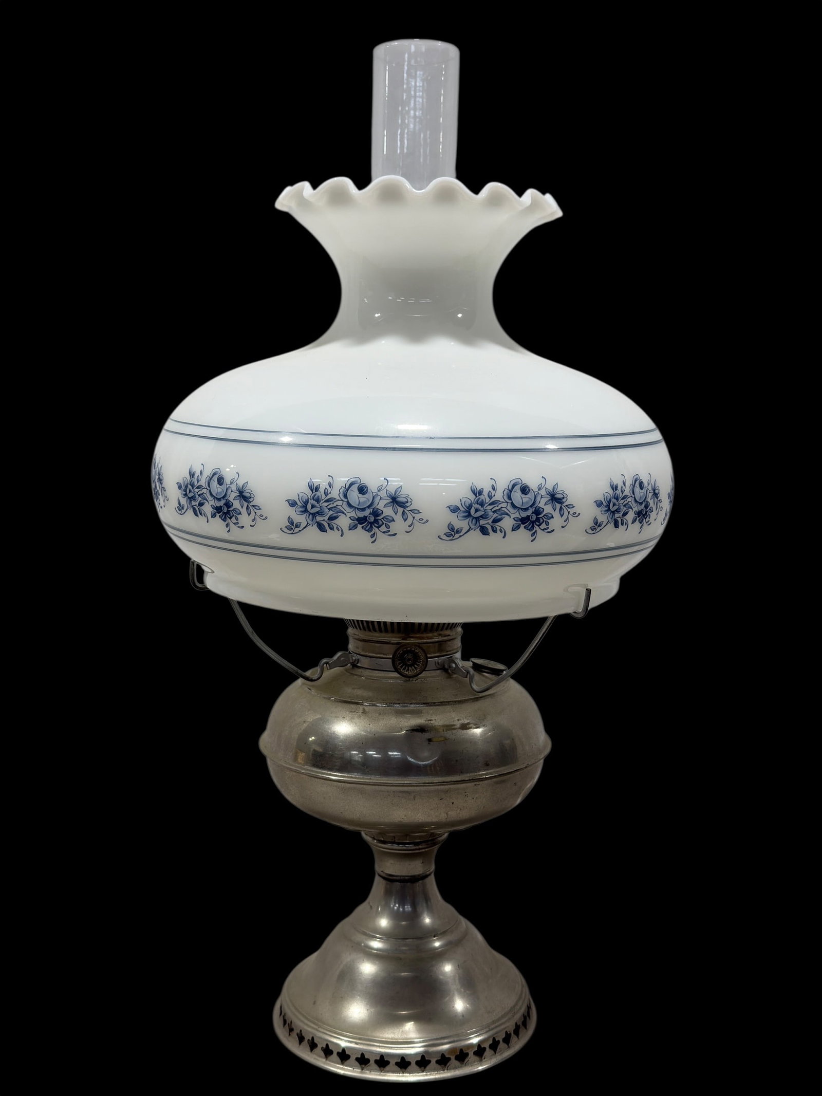 Vintage Dietz "No. 2" Kerosene Lamp with Milk Glass Shade: Early-to-mid 20th century kerosene lamp featuring a pressed metal reservoir and pedestal base fitted with a white milk glass hurricane shade decorated with a blue floral transfer border. The lamp reta