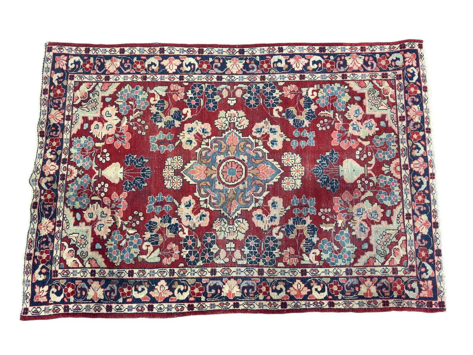 Antique Persian Lillihan Wool Area Rug: An antique Persian Lillihan hand-knotted wool area rug. The rectangular composition features a vibrant crimson red field adorned with a large, elaborate central floral medallion in shades of dusty ros