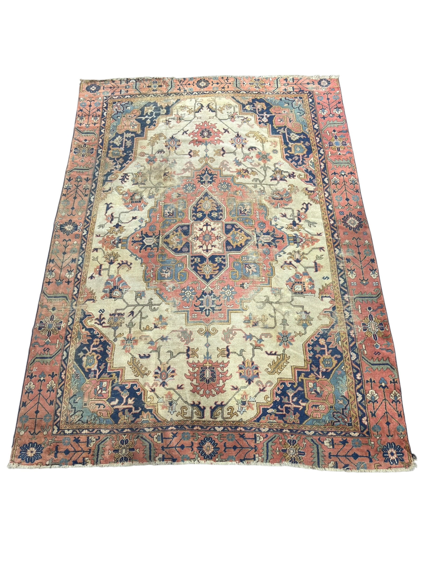 Late 19th Century Persian Mahal Wool Area Rug: A late 19th century Persian Mahal hand-knotted wool area rug. The large rectangular composition features an ivory field centered by an oversized, multi-lobed medallion in shades of salmon pink, deep n