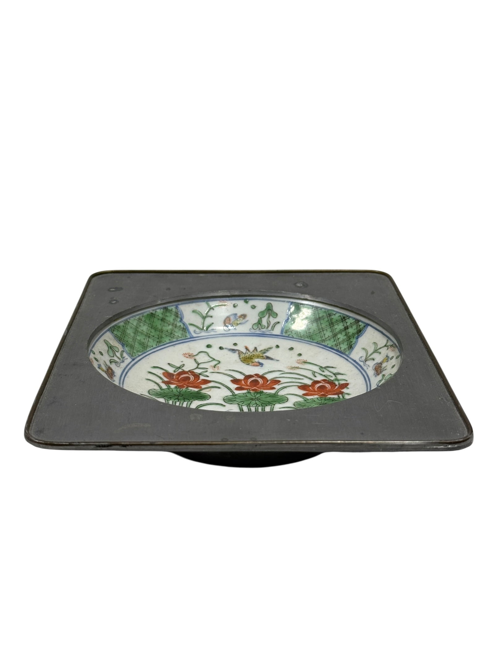 Chinese Export Style Pewter-Mounted Porcelain Dish: A twentieth-century Chinese export style porcelain dish encased within a square pewter mount. The circular porcelain insert is hand-painted in Hong Kong over a Japanese porcelain blank, featuring a ce
