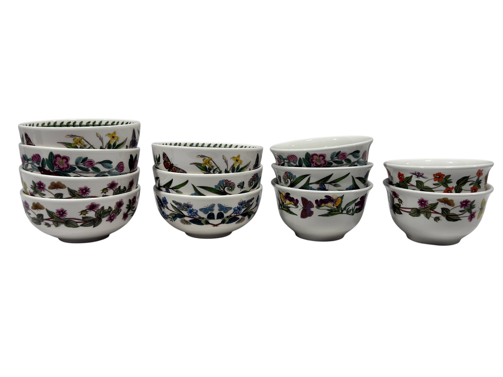 (12 Pc) Portmeirion "The Botanic Garden" Bowls: A collection of twelve ceramic cereal or oatmeal bowls from Portmeirion’s classic "The Botanic Garden" pattern. Each circular bowl features a gently flared rim and is decorated with a variety of det