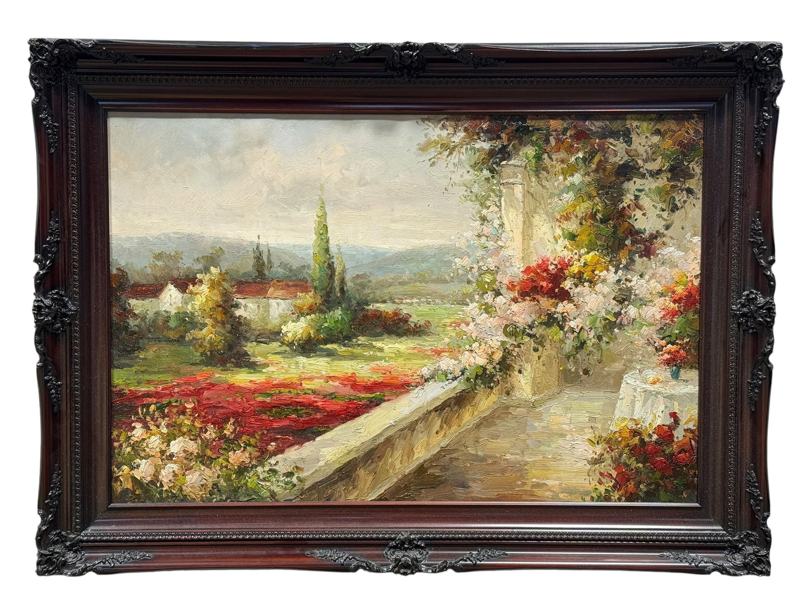 Oil on Canvas European Balcony Landscape Painting: Oil on canvas painting depicting an inviting European-inspired garden terrace overlooking a rolling pastoral landscape with cypress trees, flowering fields, and whitewashed buildings in the distance. 
