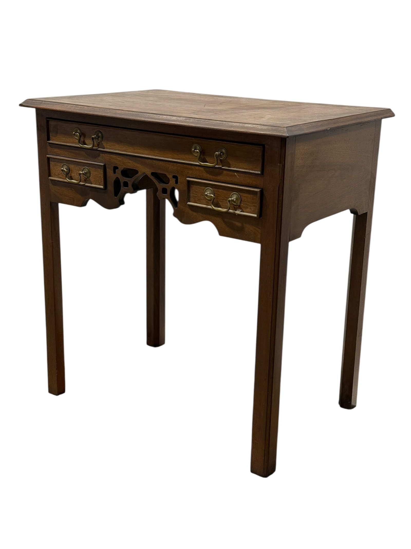 Late 20th C. Southampton Chippendale Style Mahogany Side Table: A finely proportioned Chippendale-style mahogany side table by Southampton, identified by the maker’s label inside the drawer. The rectangular molded top surmounts a traditional three-drawer arrange