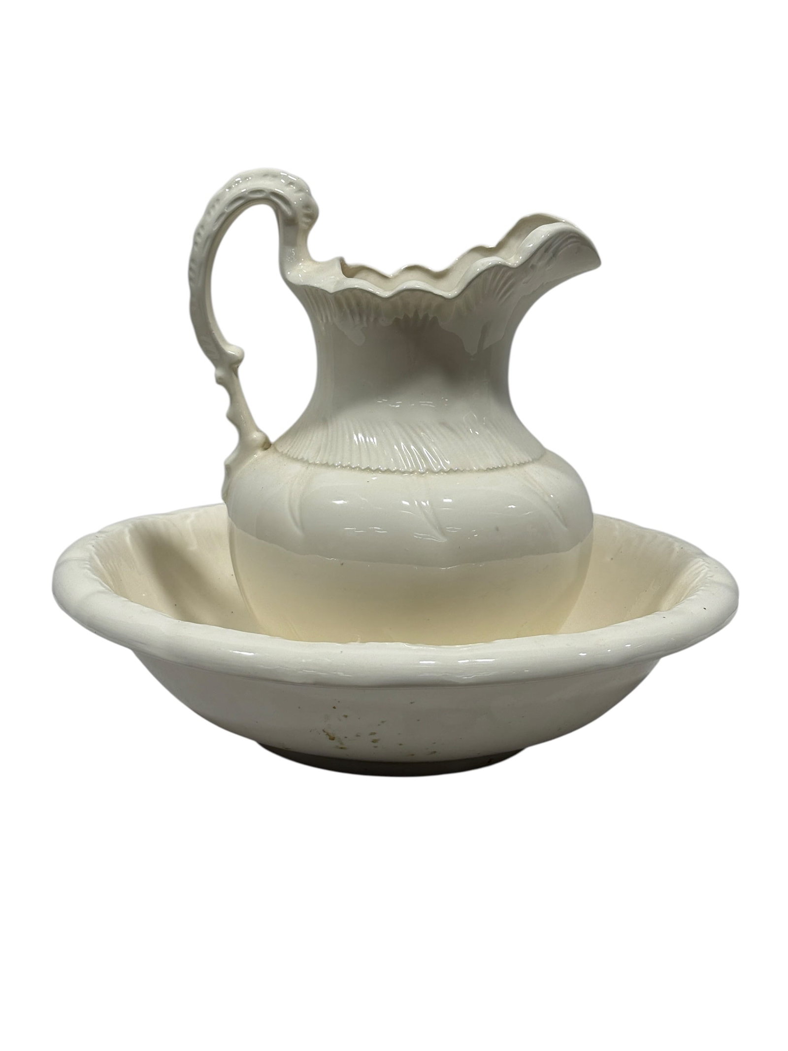 Late 19th C. White Ironstone Pitcher & Wash Basin Set: A handsome late 19th-century white ironstone wash set comprising a generously proportioned pitcher and coordinating circular basin, both finished in a clean glossy white glaze. The pitcher features a 