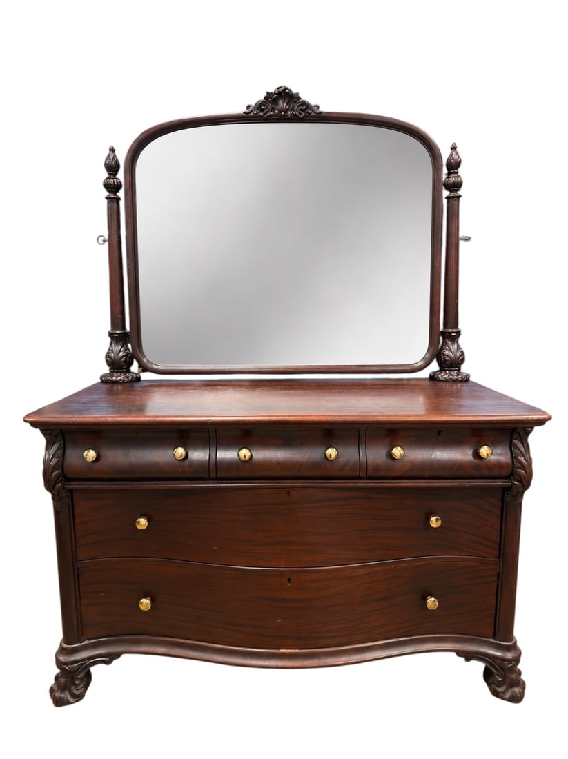 c. 1900 Victorian Solid Mahogany Serpentine Dresser w/ Mirror: Substantial late Victorian solid mahogany dresser featuring a dramatic serpentine-front case with three smaller drawers above three full-width graduated drawers, carved foliate corner embellishments, 