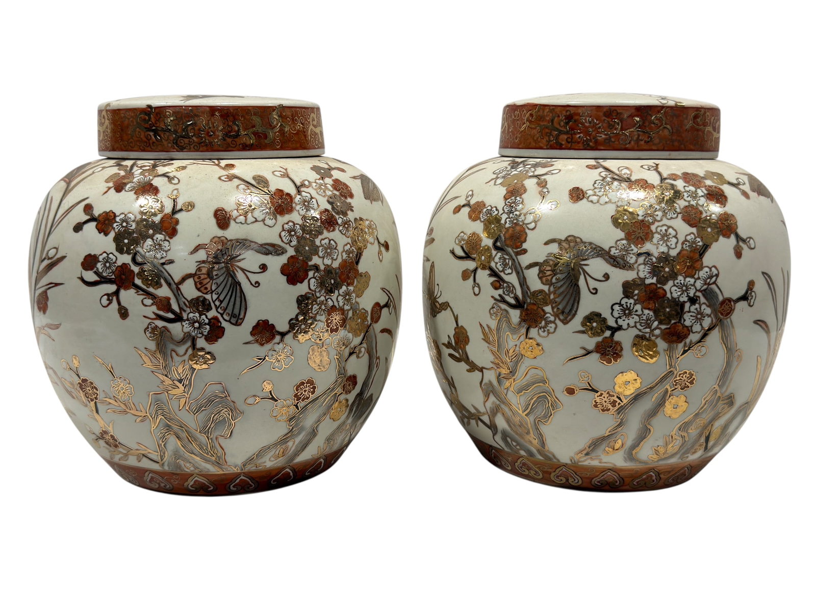 20th C. Asian Gilt and Enameled Porcelain Ginger Jars, Pair: A decorative pair of covered porcelain ginger jars, each with a rounded baluster-form body and fitted circular lid. The pale celadon-toned grounds are richly embellished with flowering branches, butte