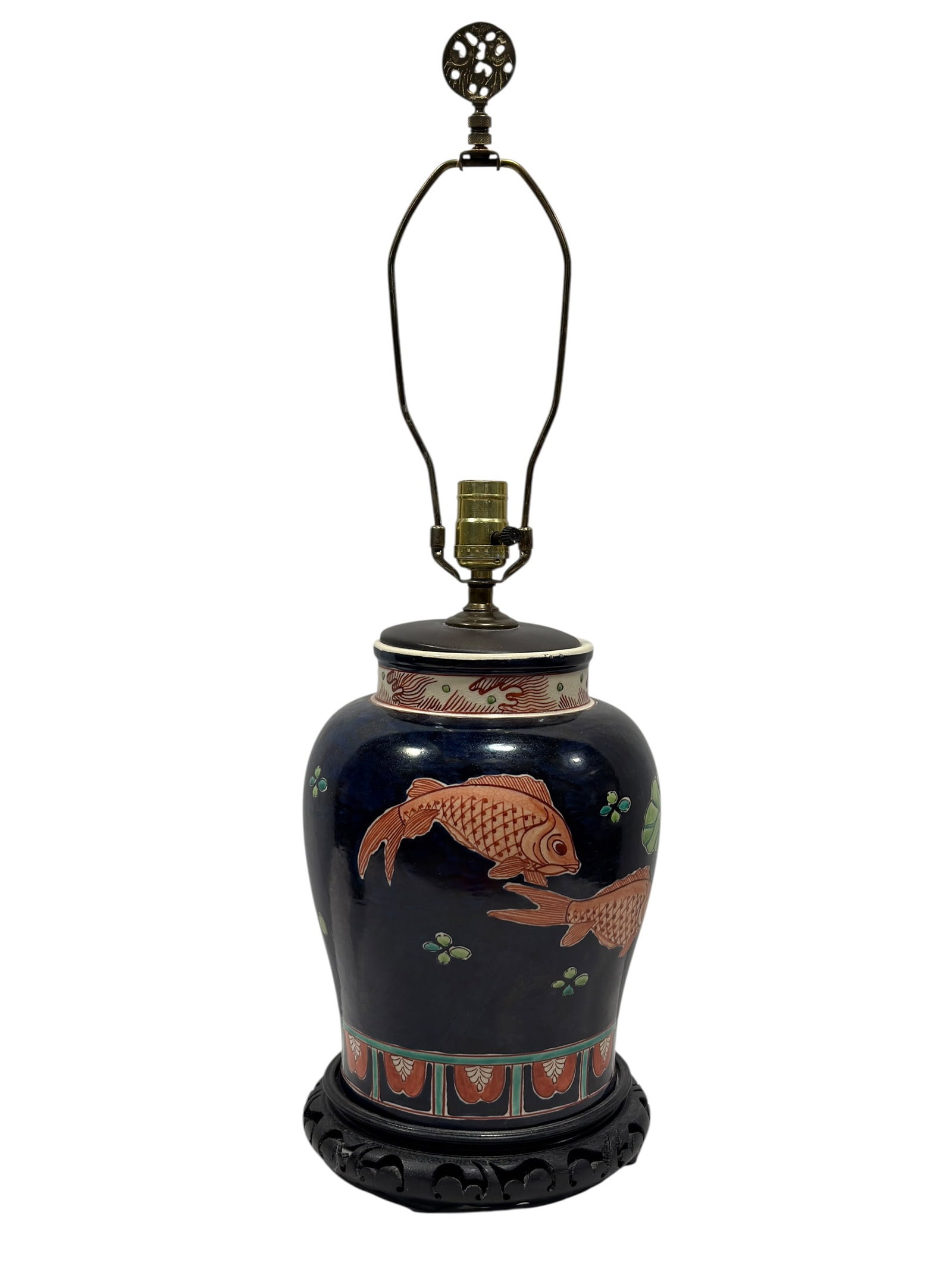 Asian Porcelain Koi & Lotus Urn Form Table Lamp: Asian-style porcelain table lamp fashioned from a baluster-form covered urn, decorated against a deep cobalt-blue ground with iron-red koi swimming among green lotus leaves, buds, and scattered aquati