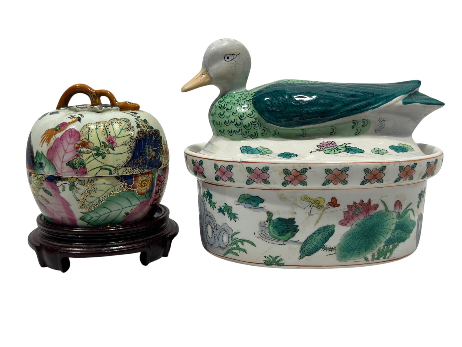 (2) Chinese Polychrome Porcelain Covered Dishes: Group of two decorative Chinese porcelain covered vessels comprising a famille verte-style oval tureen surmounted by a fully modeled duck finial and a rounded fruit-form jar with an intertwined branch