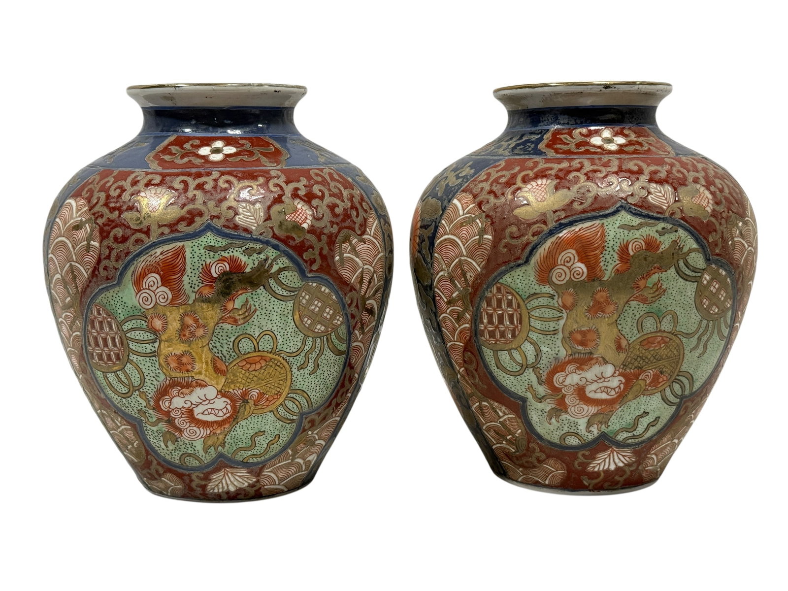 Pair of Japanese Imari Porcelain Baluster Vases, Early 20th C.: Pair of Japanese Imari porcelain vases of rounded baluster form with short flared necks, richly hand decorated in the traditional palette of cobalt blue, iron red, green enamels, and gilt. The bodies 