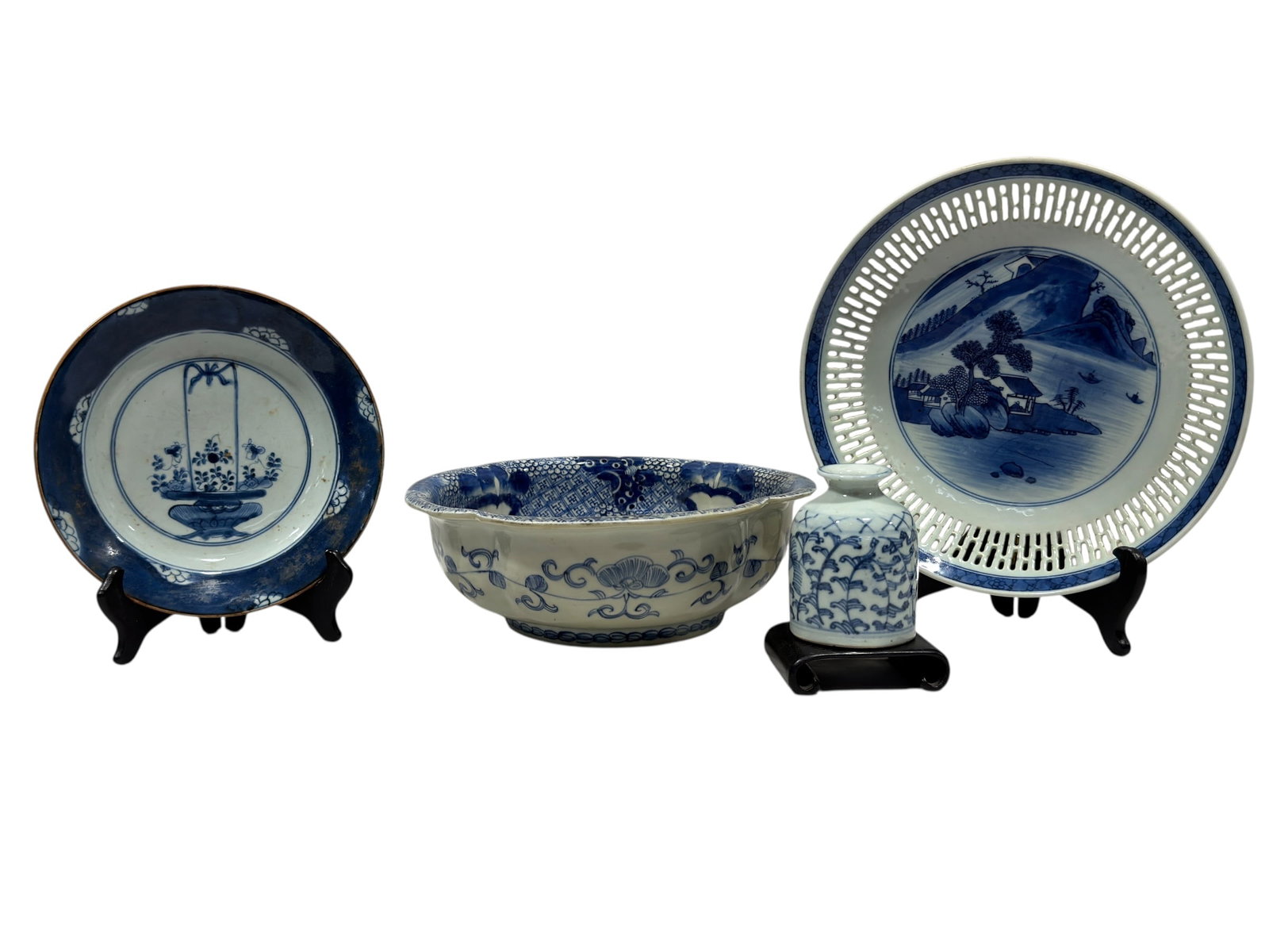 Group of 4 Chinese Blue and White Porcelain Articles: An assembled group of four Chinese blue and white porcelain articles comprising a deep bowl, two circular plates, and a small baluster-form vase, each decorated in underglaze cobalt blue on a white gr