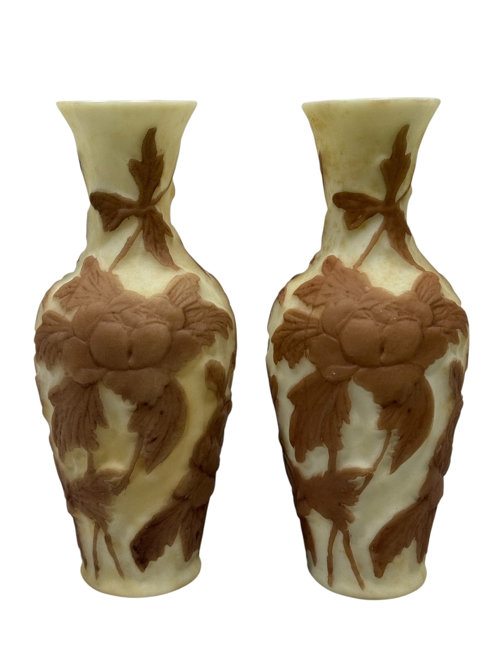 Phoenix Consolidated Circa 1930 Martele Line Uranium Glass Floral Vases, Pair: A matched pair of circa 1930 Phoenix Consolidated Glass Company Martele line vases, each formed in pale custard uranium glass with softly flared rims, slender waisted necks, rounded shoulders, and gen