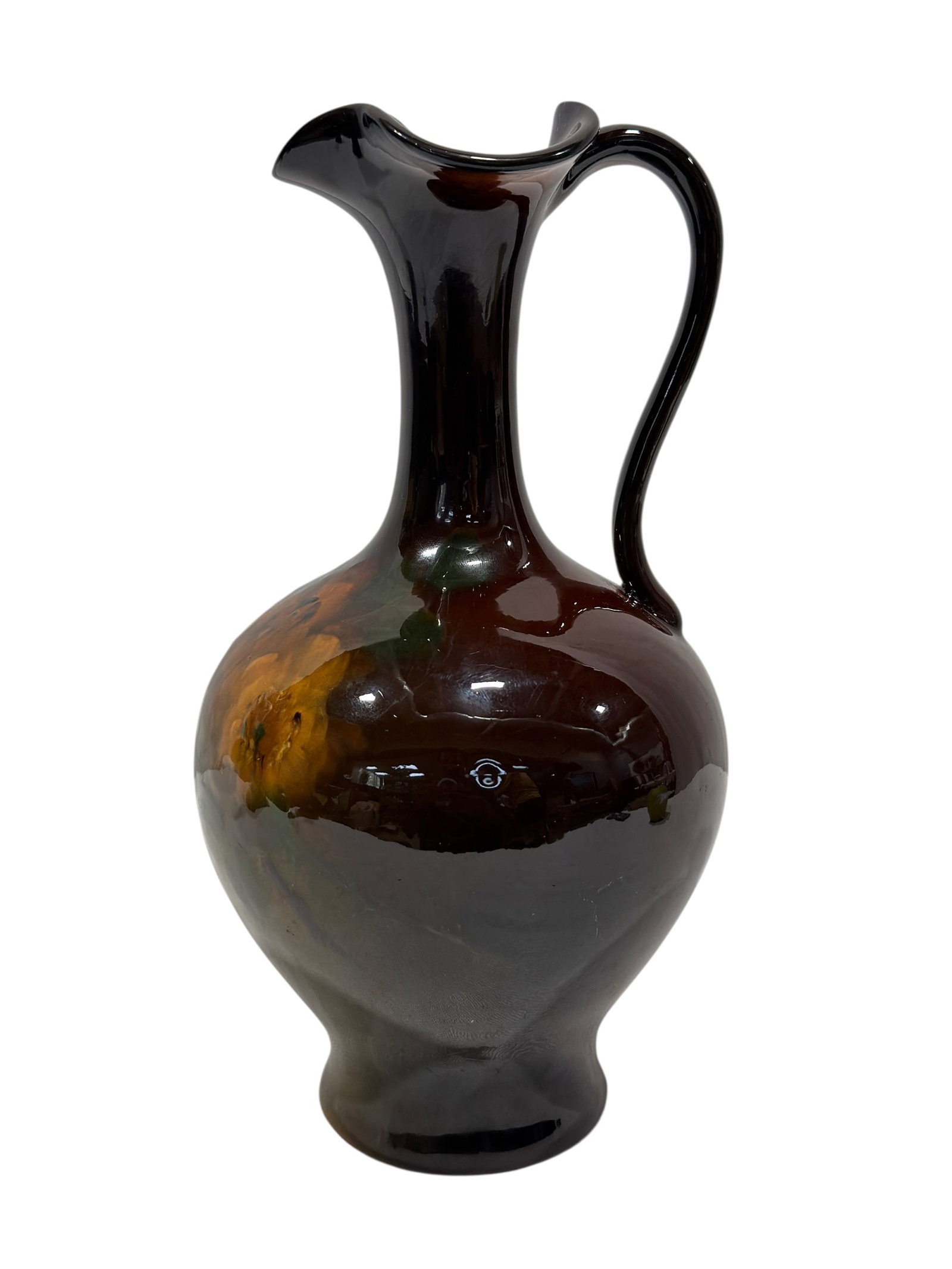 Antique Weller Louwelsa Art Nouveau Floral Ewer: A handsome American art pottery ewer from Weller’s celebrated Louwelsa line, fashioned with a rounded bulbous body, tall slender neck, applied looping handle, and deeply ruffled trefoil-form mouth. 